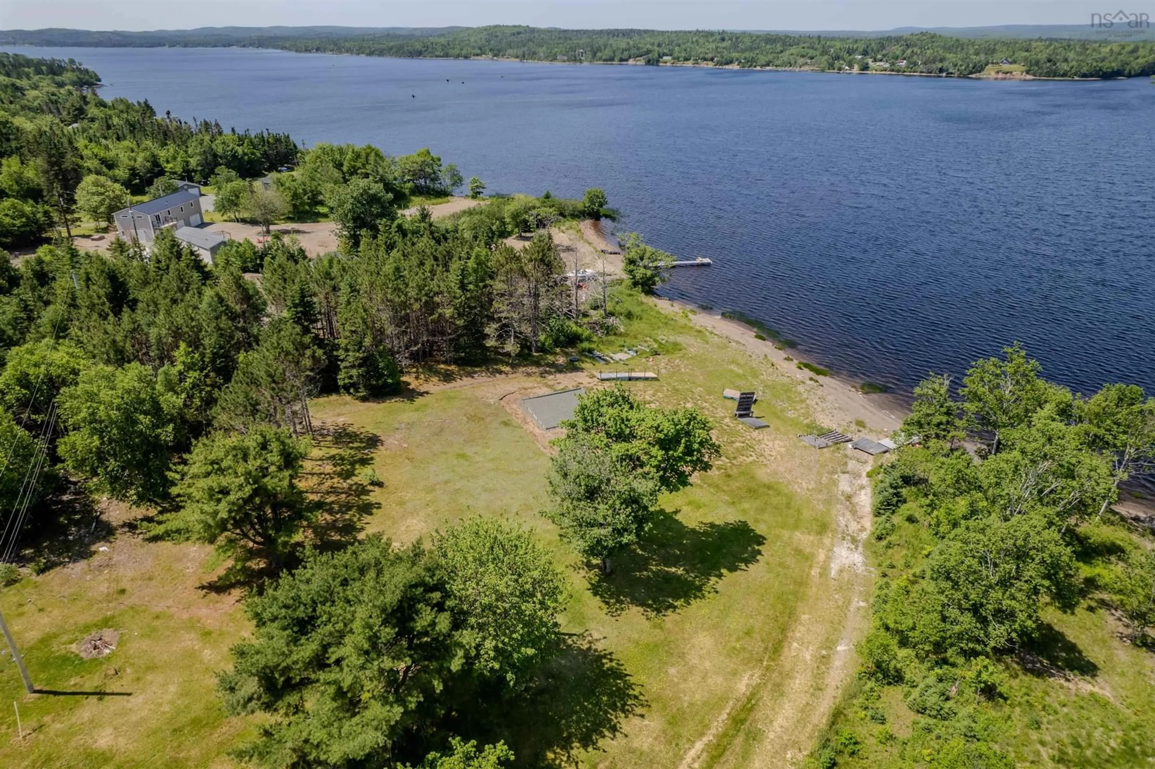 A pic from outside/outdoor area/front of a property/back of a property/a pic from drone, water/lake/river/ocean view for 1802 Grand Mira South Rd, Grand Mira South Nova Scotia B1K 1H3