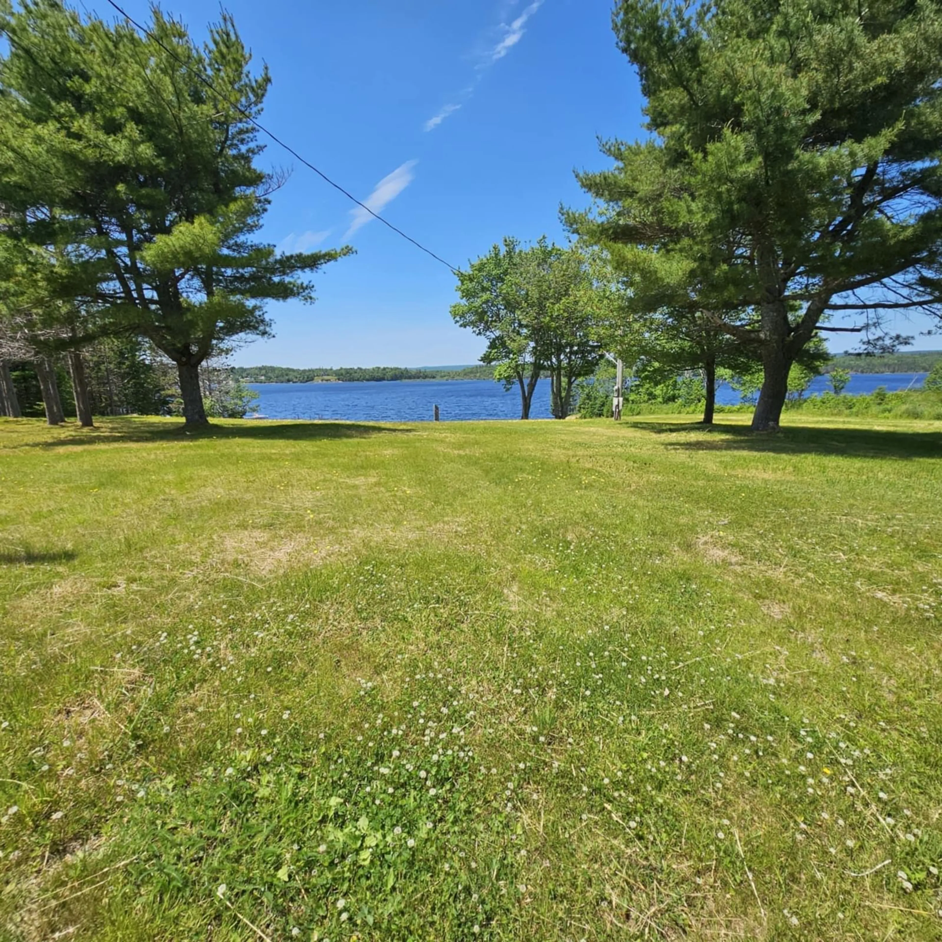 A pic from outside/outdoor area/front of a property/back of a property/a pic from drone, water/lake/river/ocean view for 1802 Grand Mira South Rd, Grand Mira South Nova Scotia B1K 1H3