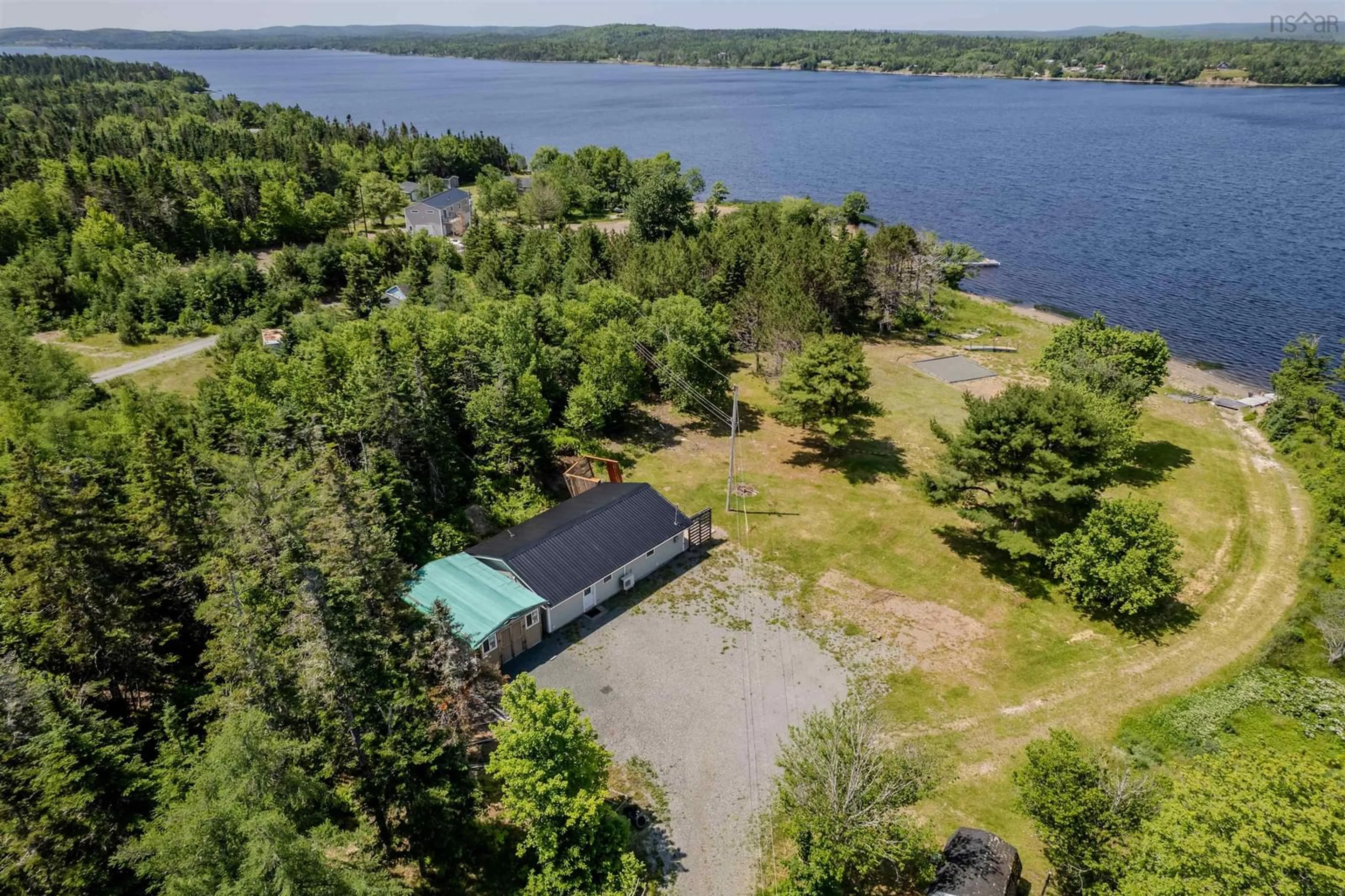 A pic from outside/outdoor area/front of a property/back of a property/a pic from drone, water/lake/river/ocean view for 1802 Grand Mira South Rd, Grand Mira South Nova Scotia B1K 1H3
