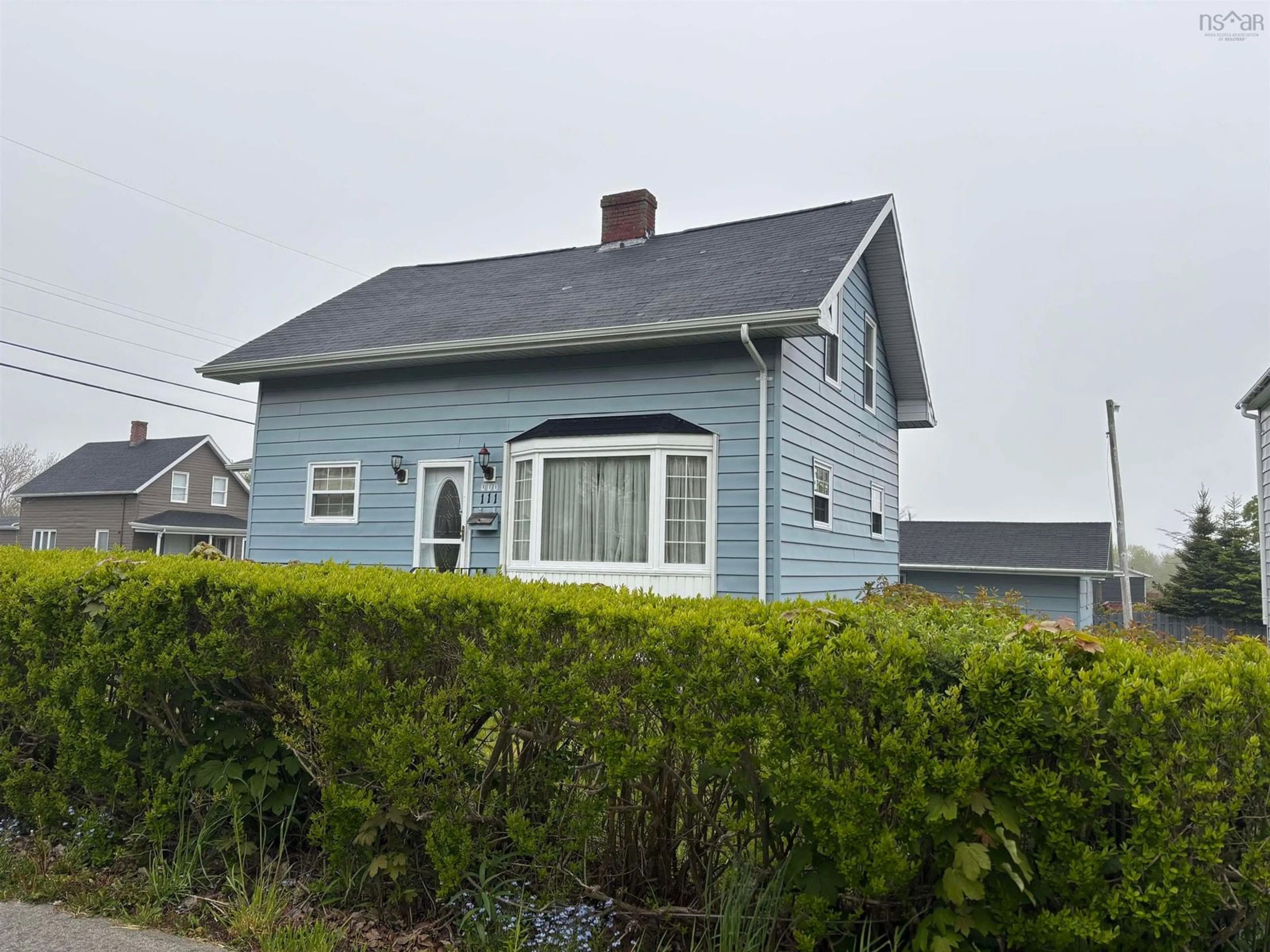 Home with vinyl exterior material, street for 111 Atlantic Street, Sydney Mines Nova Scotia B1V 1Y7