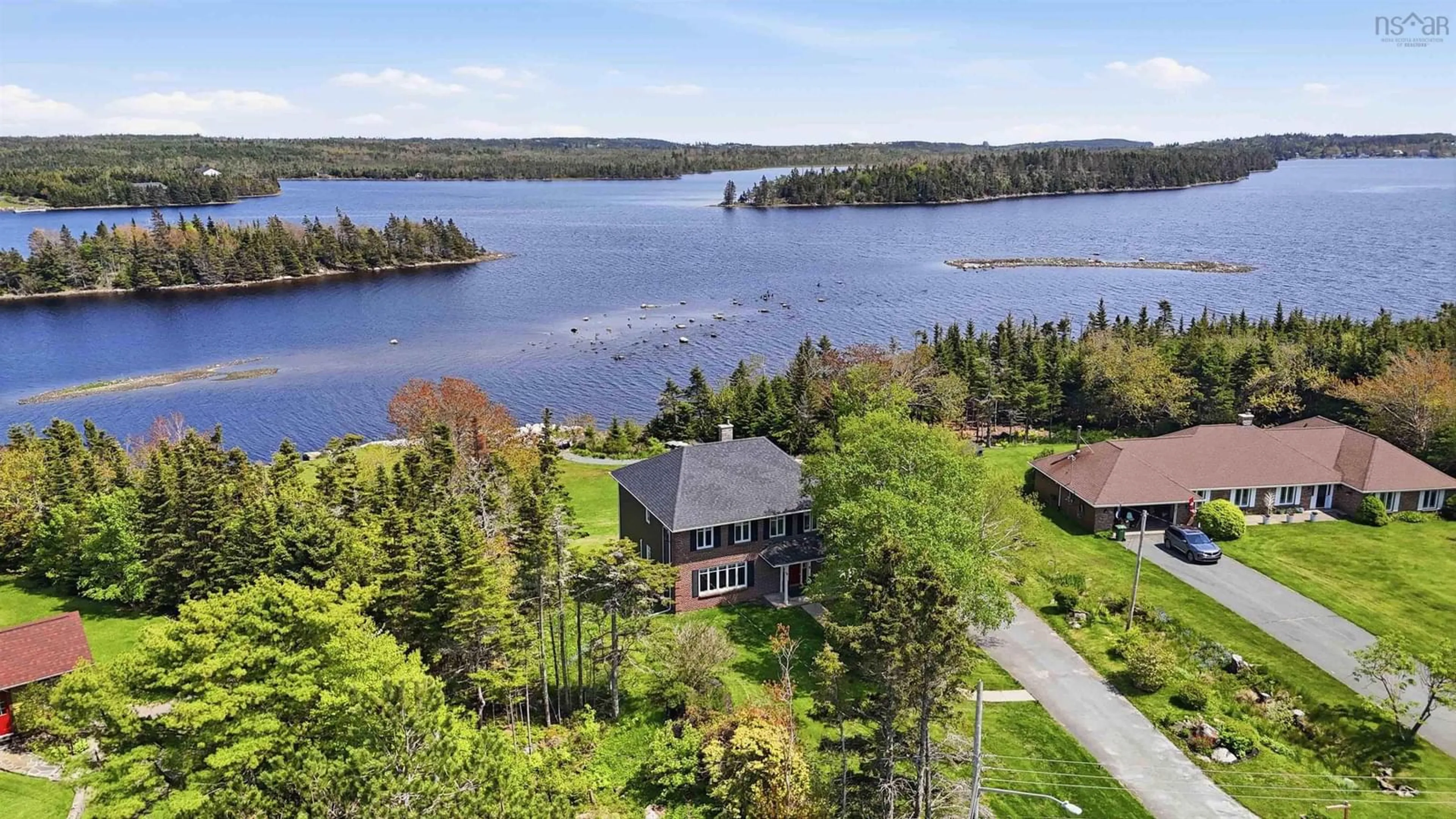 A pic from outside/outdoor area/front of a property/back of a property/a pic from drone, water/lake/river/ocean view for 30 Capri Island Close, West Porters Lake Nova Scotia B3E 1L6