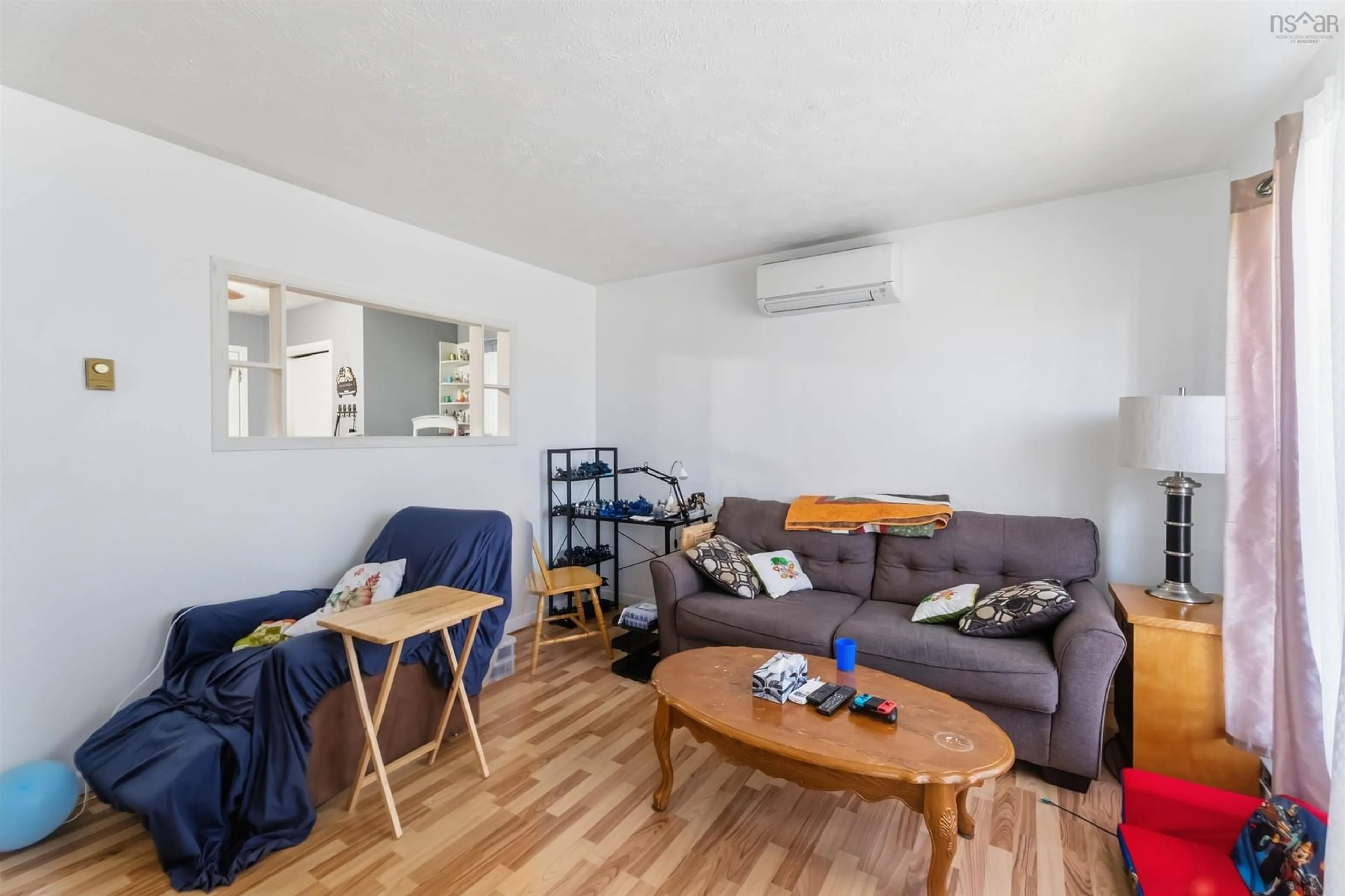 Living room with furniture, wood/laminate floor for 5786 Prospect Rd, New Minas Nova Scotia B4N 3K4