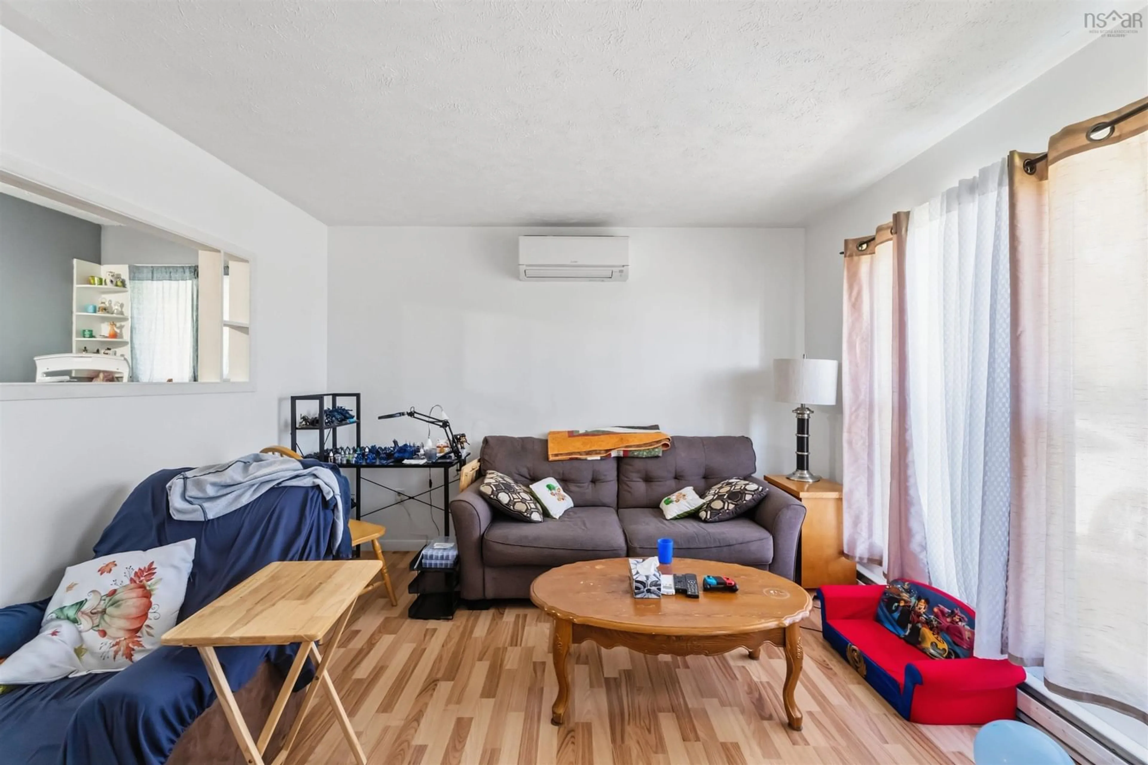 Living room with furniture, wood/laminate floor for 5786 Prospect Rd, New Minas Nova Scotia B4N 3K4