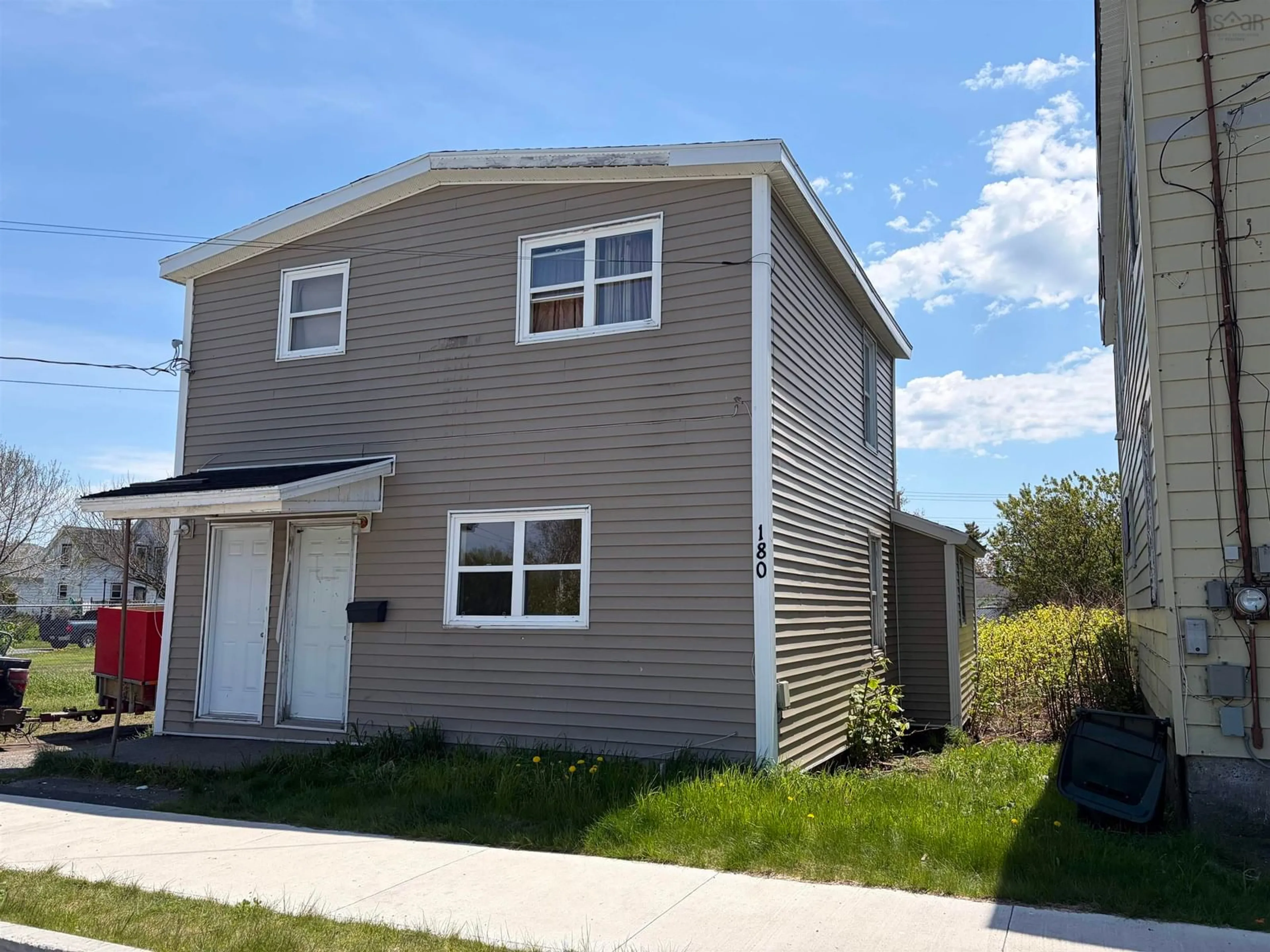 Home with vinyl exterior material, street for 180 Bay St, Sydney Nova Scotia B1N 2J8