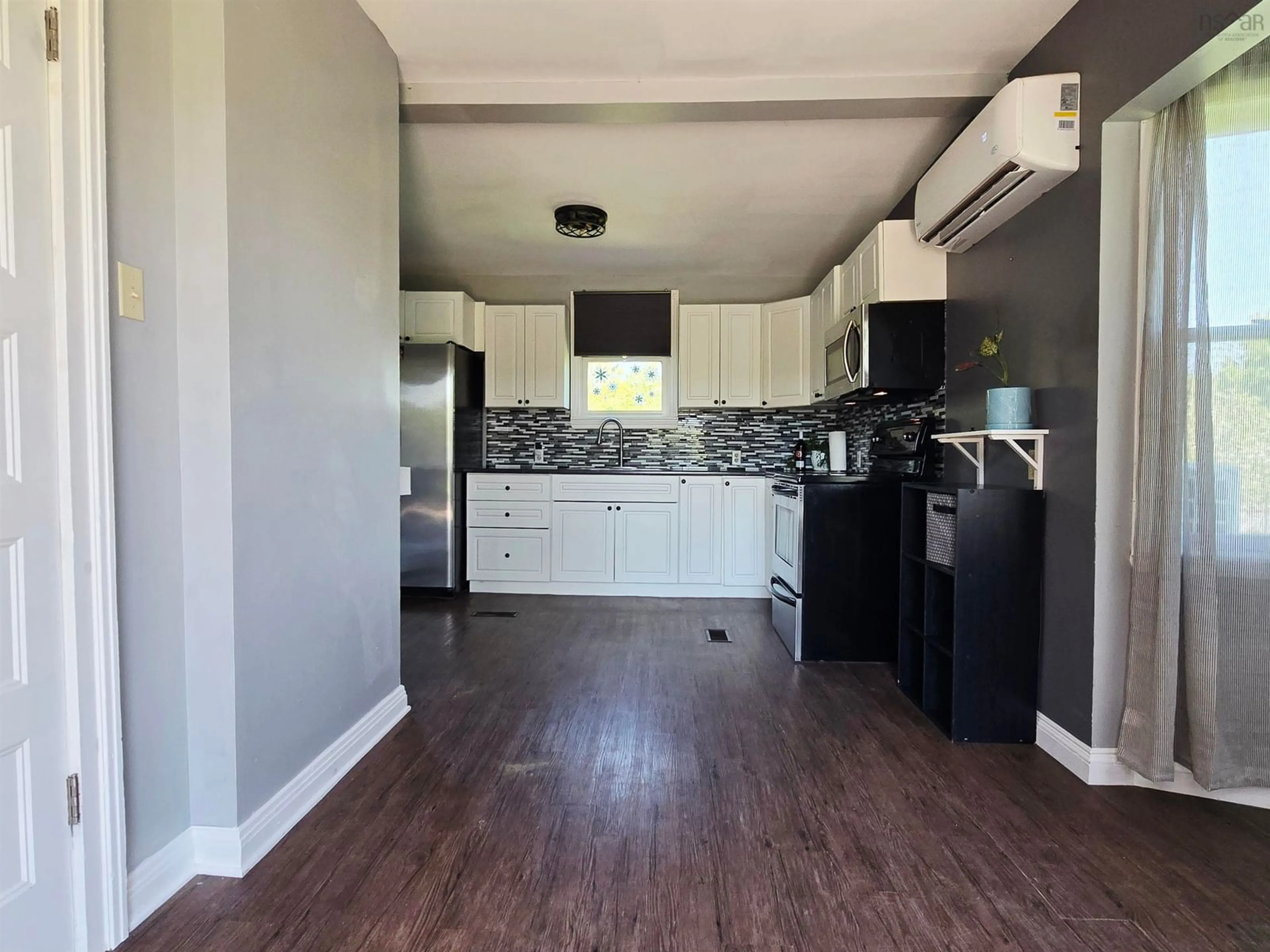 Open concept kitchen, wood/laminate floor for 337 Tremont St, New Glasgow Nova Scotia B2H 3Z6