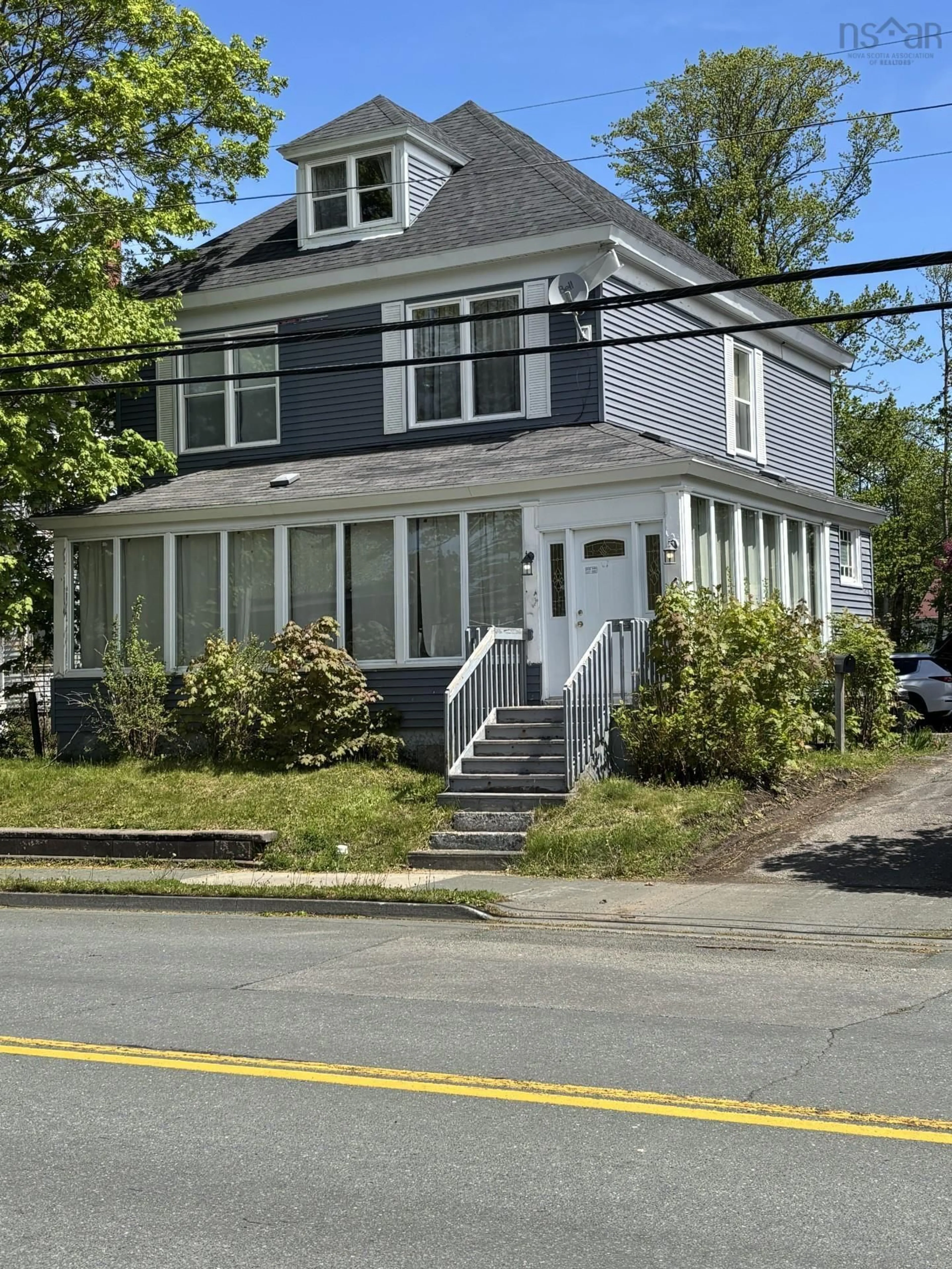 Home with vinyl exterior material, street for 49 King St, North Sydney Nova Scotia B2A 2S9