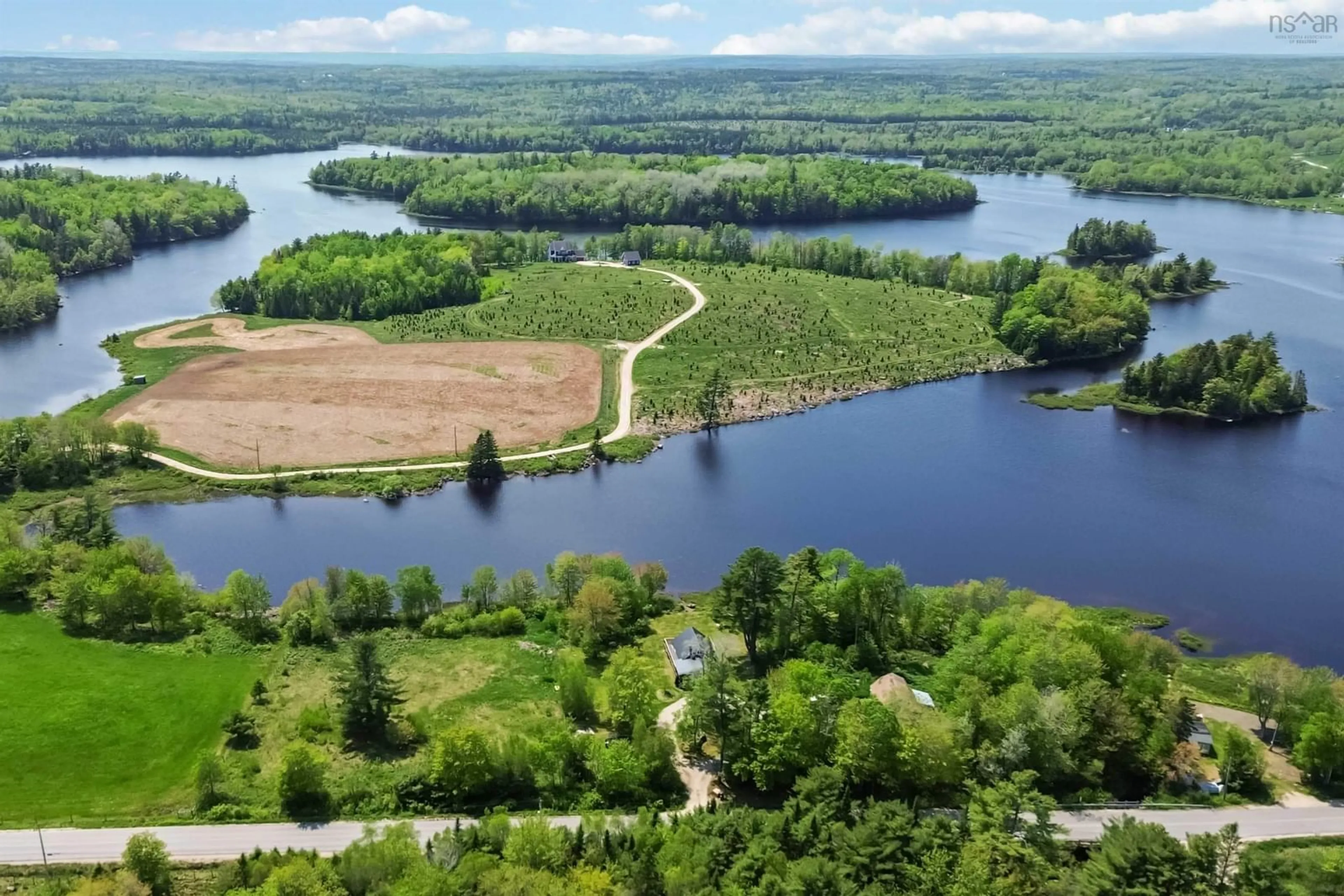 A pic from outside/outdoor area/front of a property/back of a property/a pic from drone, water/lake/river/ocean view for 321 Lake Ramsay Road, New Ross Nova Scotia B0J 2M0