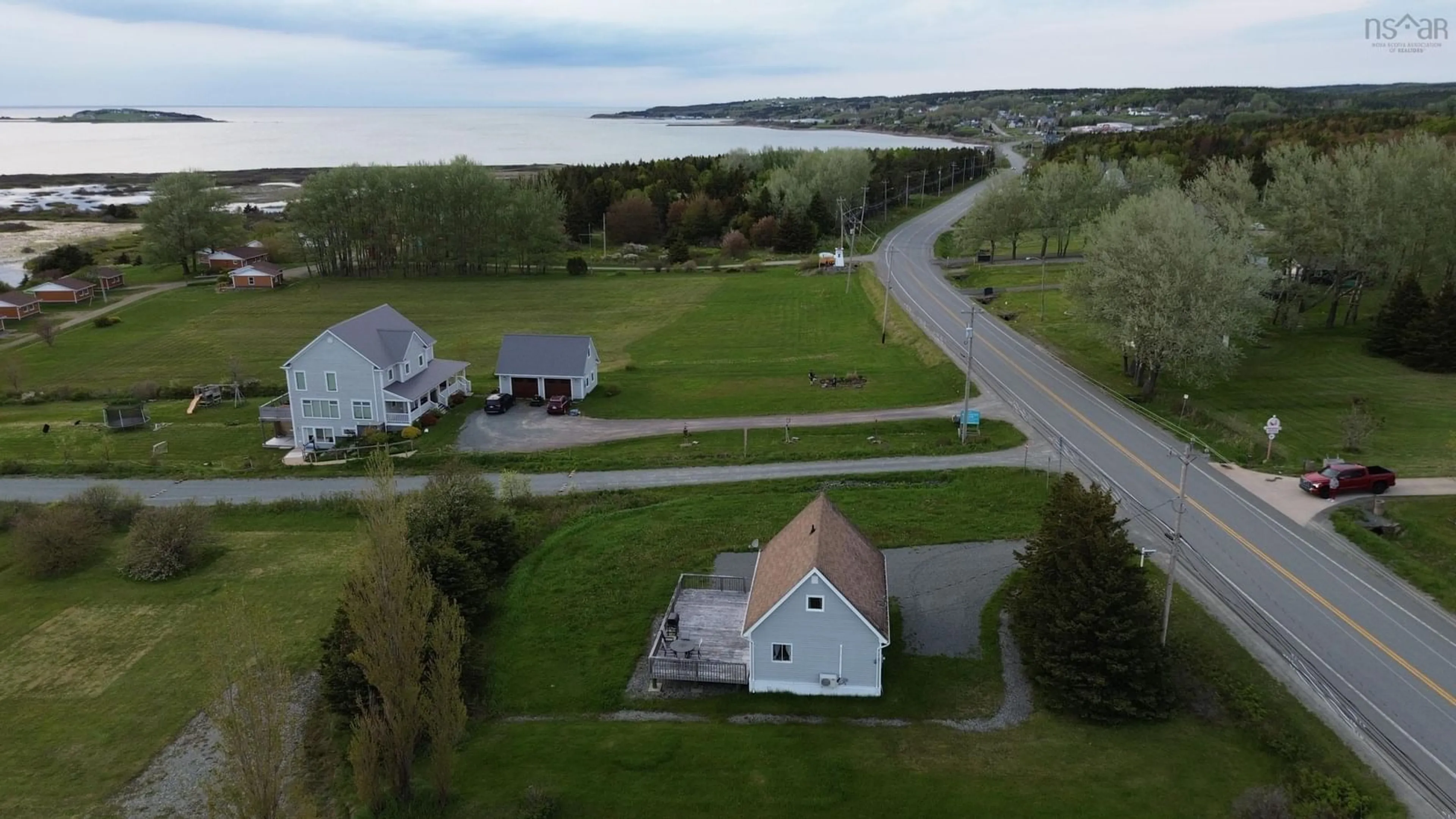 A pic from outside/outdoor area/front of a property/back of a property/a pic from drone, water/lake/river/ocean view for 8521 19 Hwy, Port Hood Nova Scotia B0E 2W0