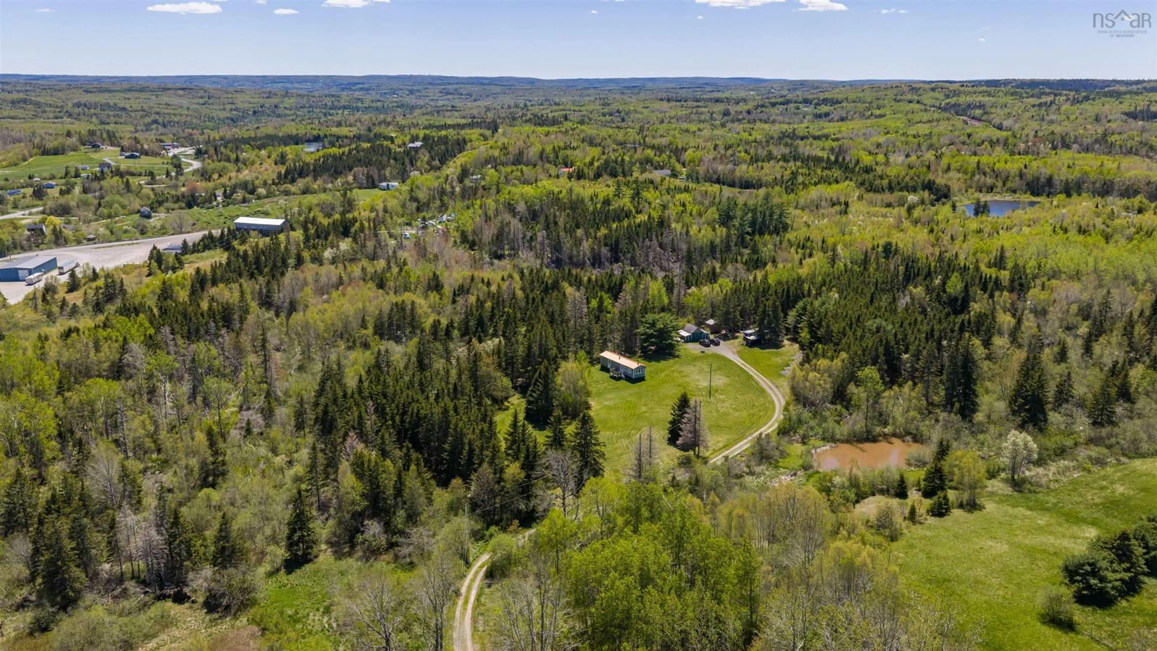A pic from outside/outdoor area/front of a property/back of a property/a pic from drone, forest/trees view for 71 Hummingbird Lane, Riverton Nova Scotia B0K 1S0