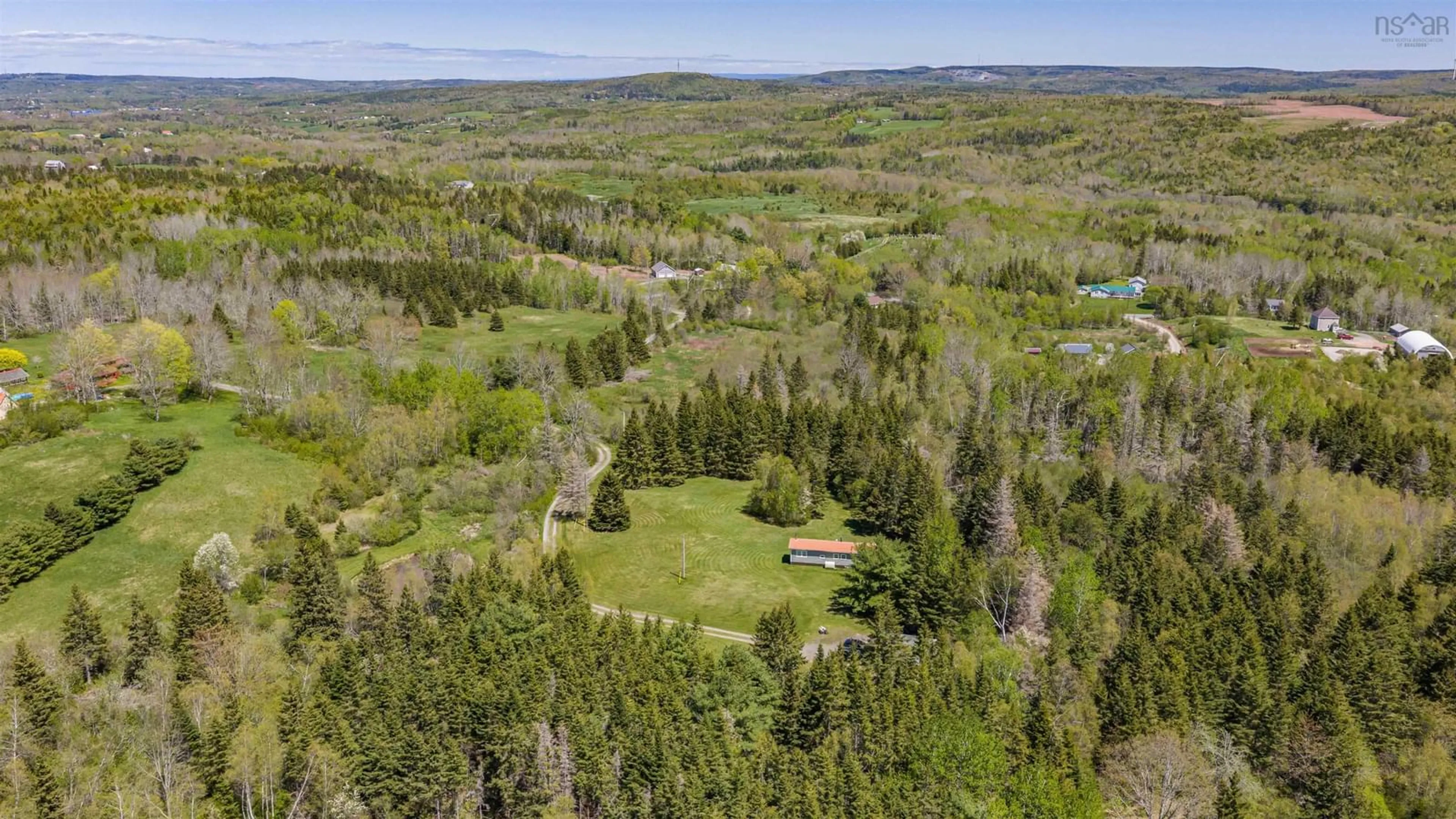 A pic from outside/outdoor area/front of a property/back of a property/a pic from drone, forest/trees view for 71 Hummingbird Lane, Riverton Nova Scotia B0K 1S0