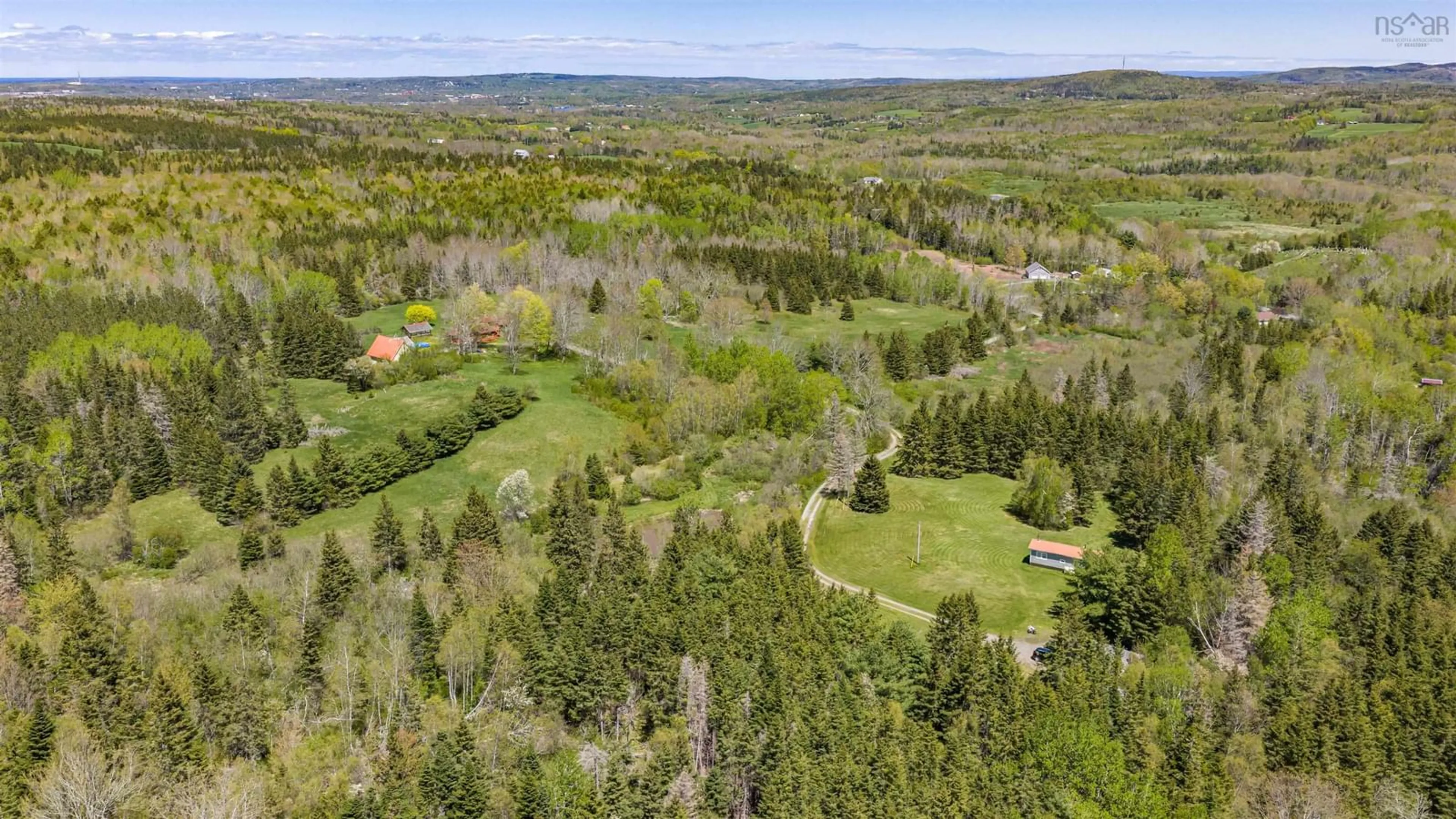 A pic from outside/outdoor area/front of a property/back of a property/a pic from drone, forest/trees view for 71 Hummingbird Lane, Riverton Nova Scotia B0K 1S0