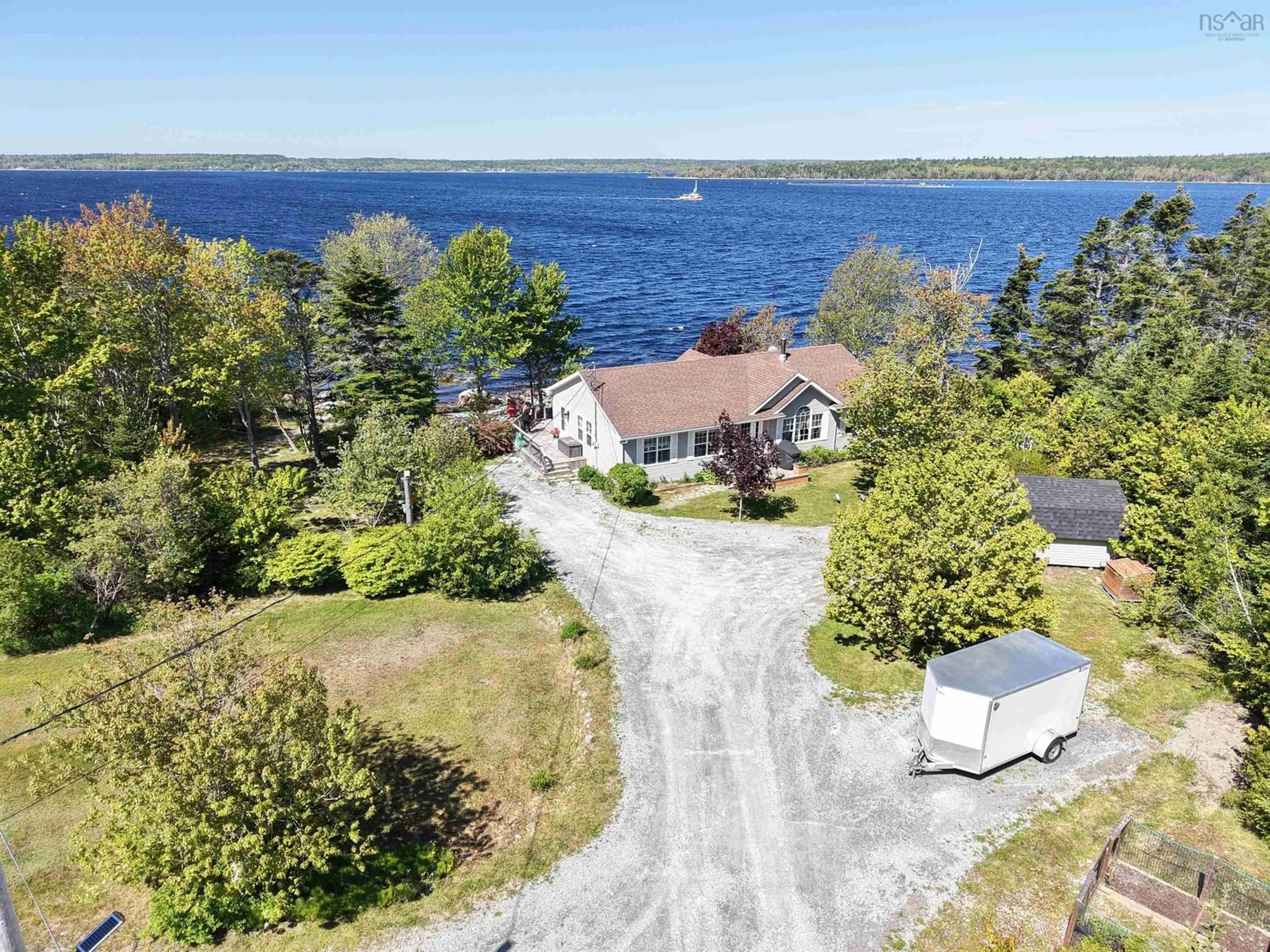 A pic from outside/outdoor area/front of a property/back of a property/a pic from drone, water/lake/river/ocean view for 650 Sandy Point Rd, Sandy Point Nova Scotia B0T 1W0