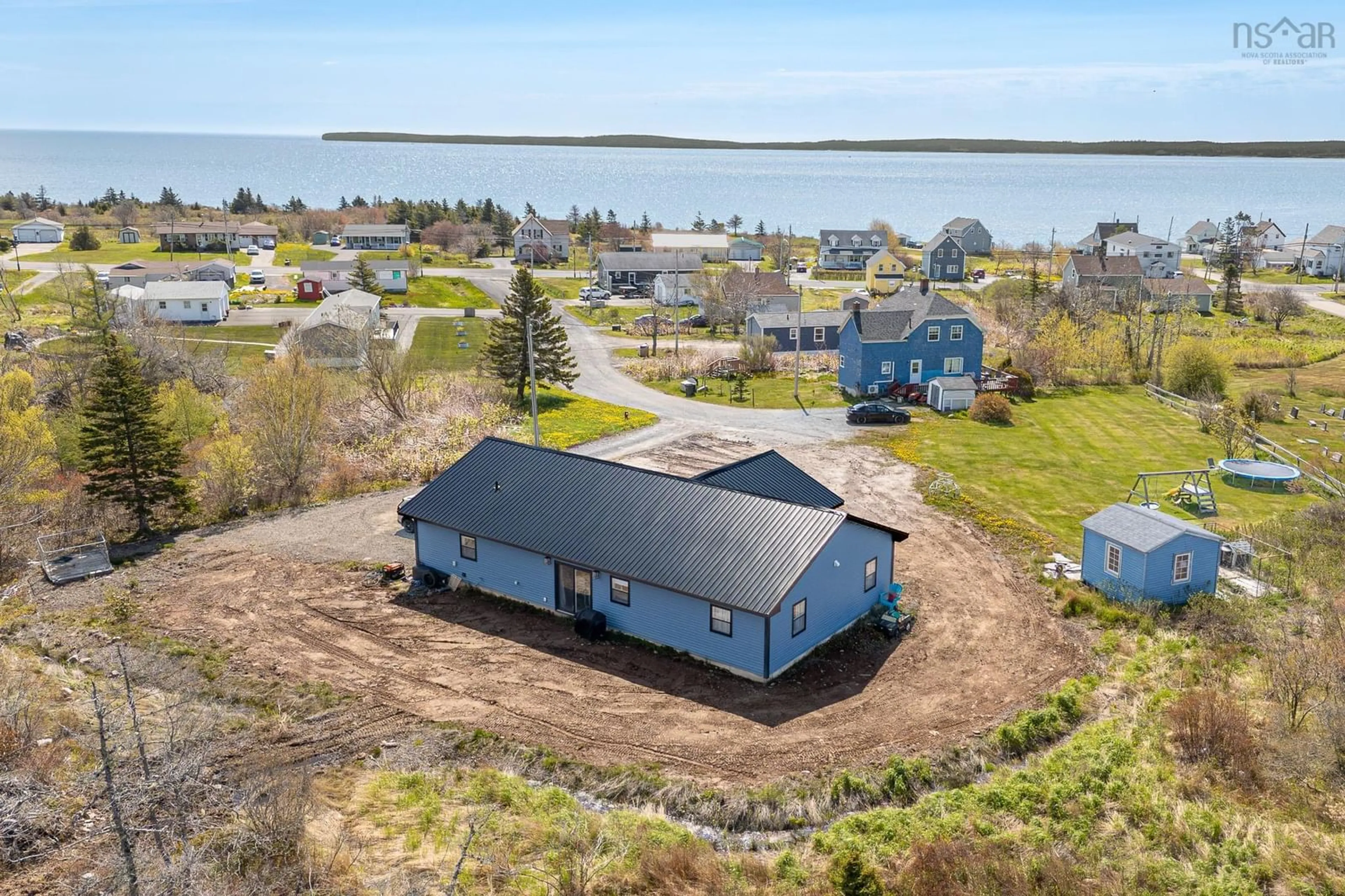 A pic from outside/outdoor area/front of a property/back of a property/a pic from drone, water/lake/river/ocean view for 29 Amy St, Port Morien Nova Scotia B1A 1A1