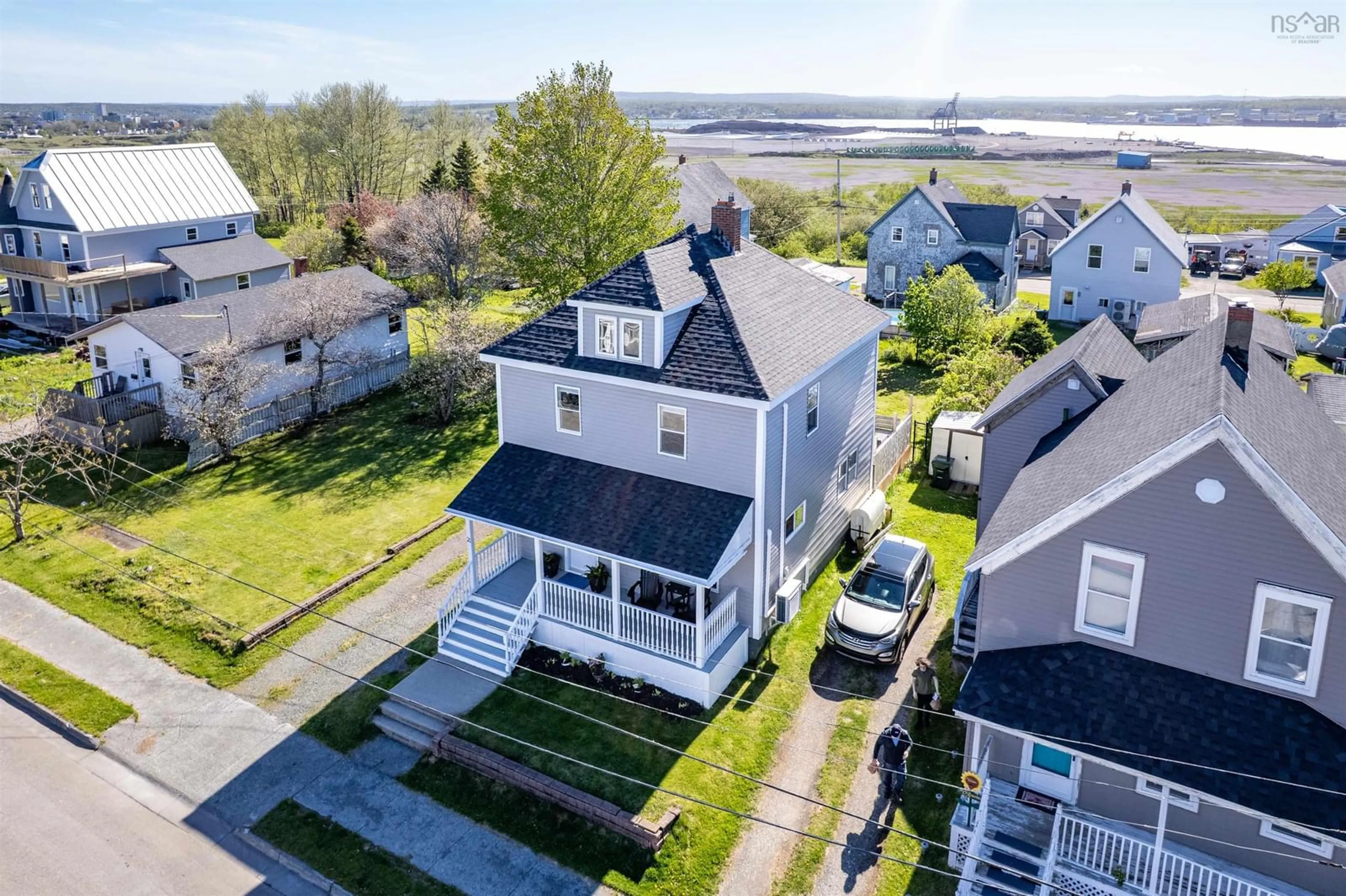 A pic from outside/outdoor area/front of a property/back of a property/a pic from drone, water/lake/river/ocean view for 21 Cameron St, Whitney Pier Nova Scotia B1N 1E2