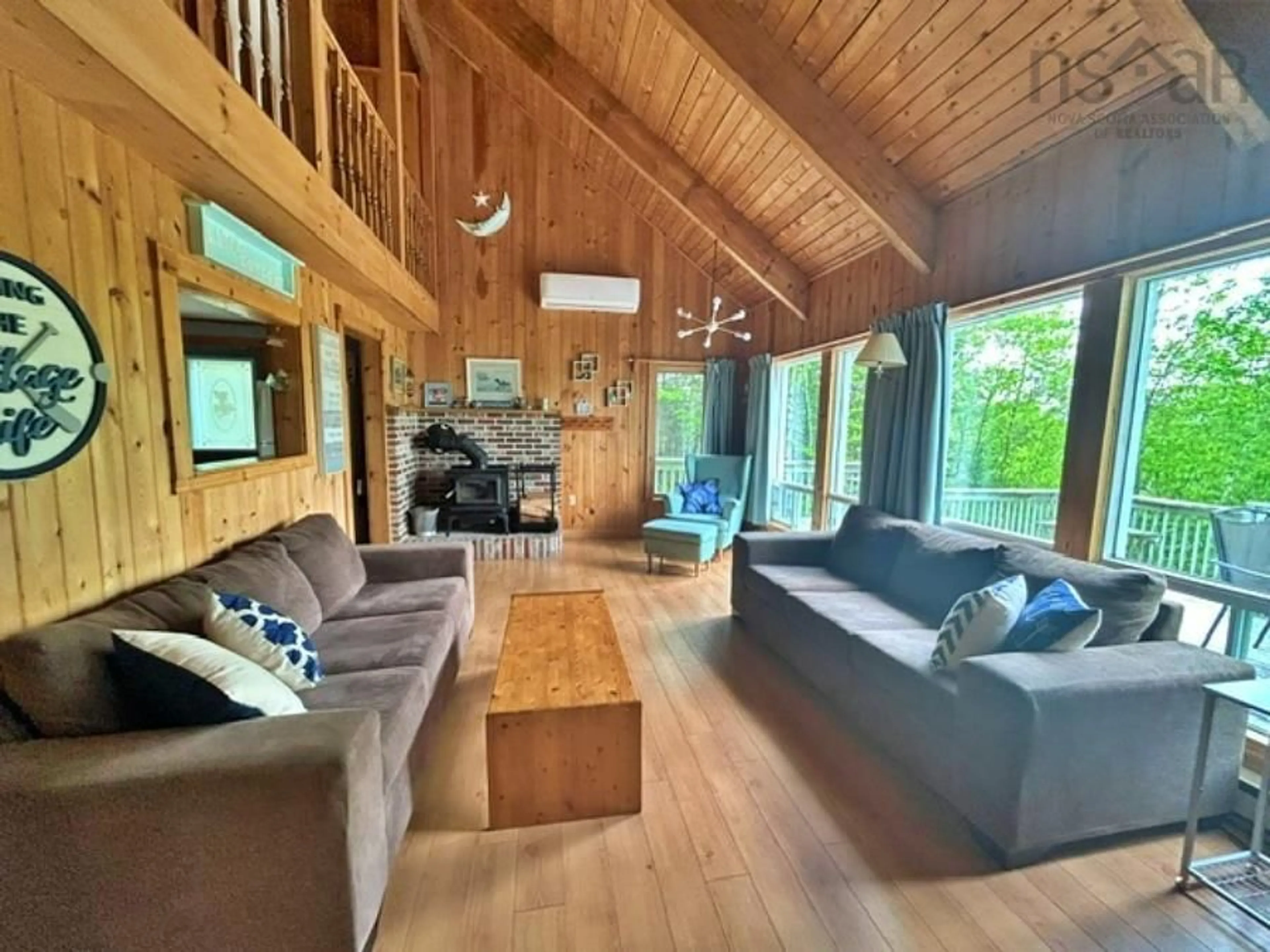 Living room with furniture, wood/laminate floor for 156 Lakewood Dr #Lot 38A, Chester Grant Nova Scotia B0J 1K0