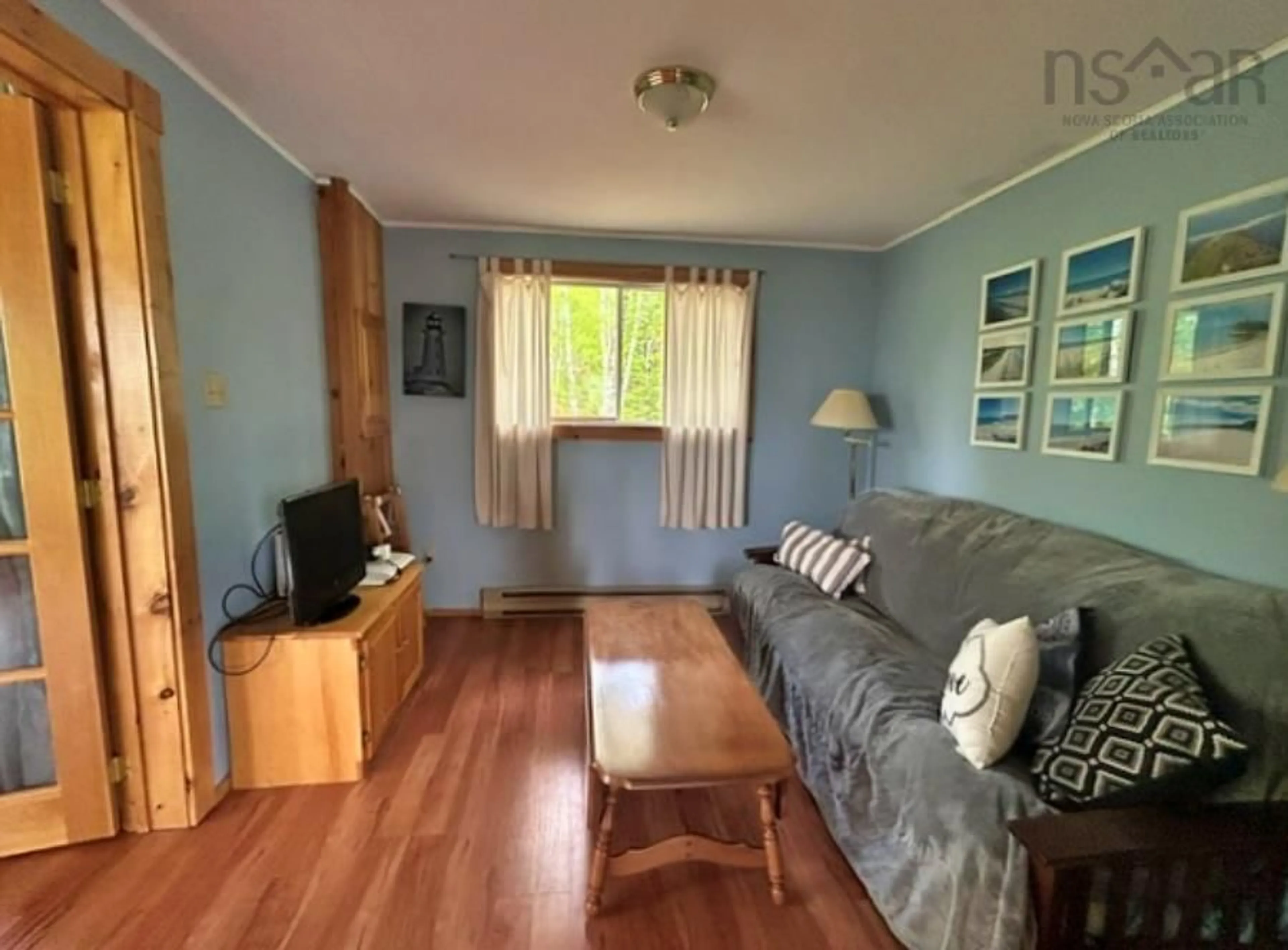 Living room with furniture, wood/laminate floor for 156 Lakewood Dr #Lot 38A, Chester Grant Nova Scotia B0J 1K0