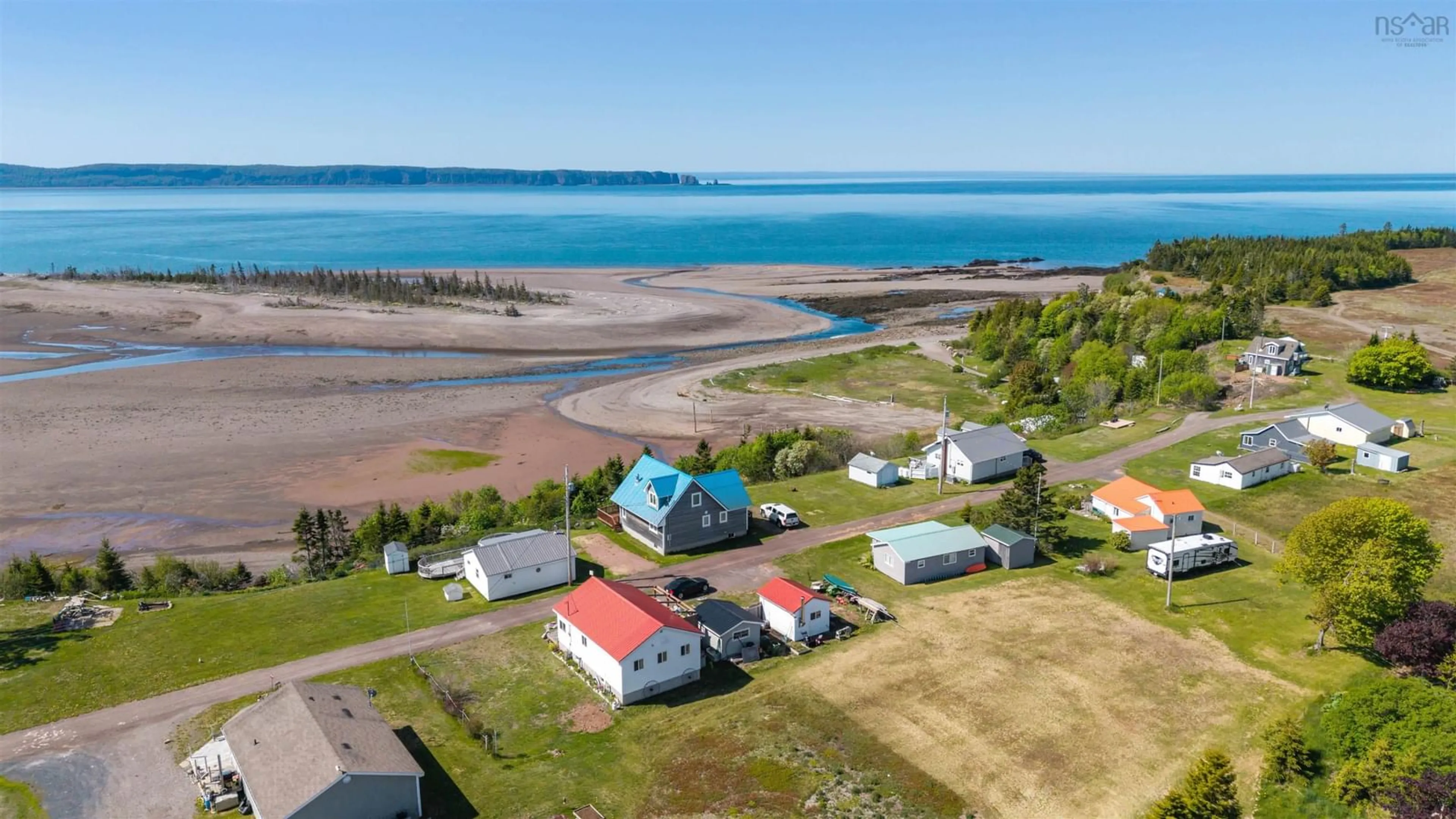 A pic from outside/outdoor area/front of a property/back of a property/a pic from drone, water/lake/river/ocean view for 243 Cottage Rd, Diligent River Nova Scotia B0M 1S0