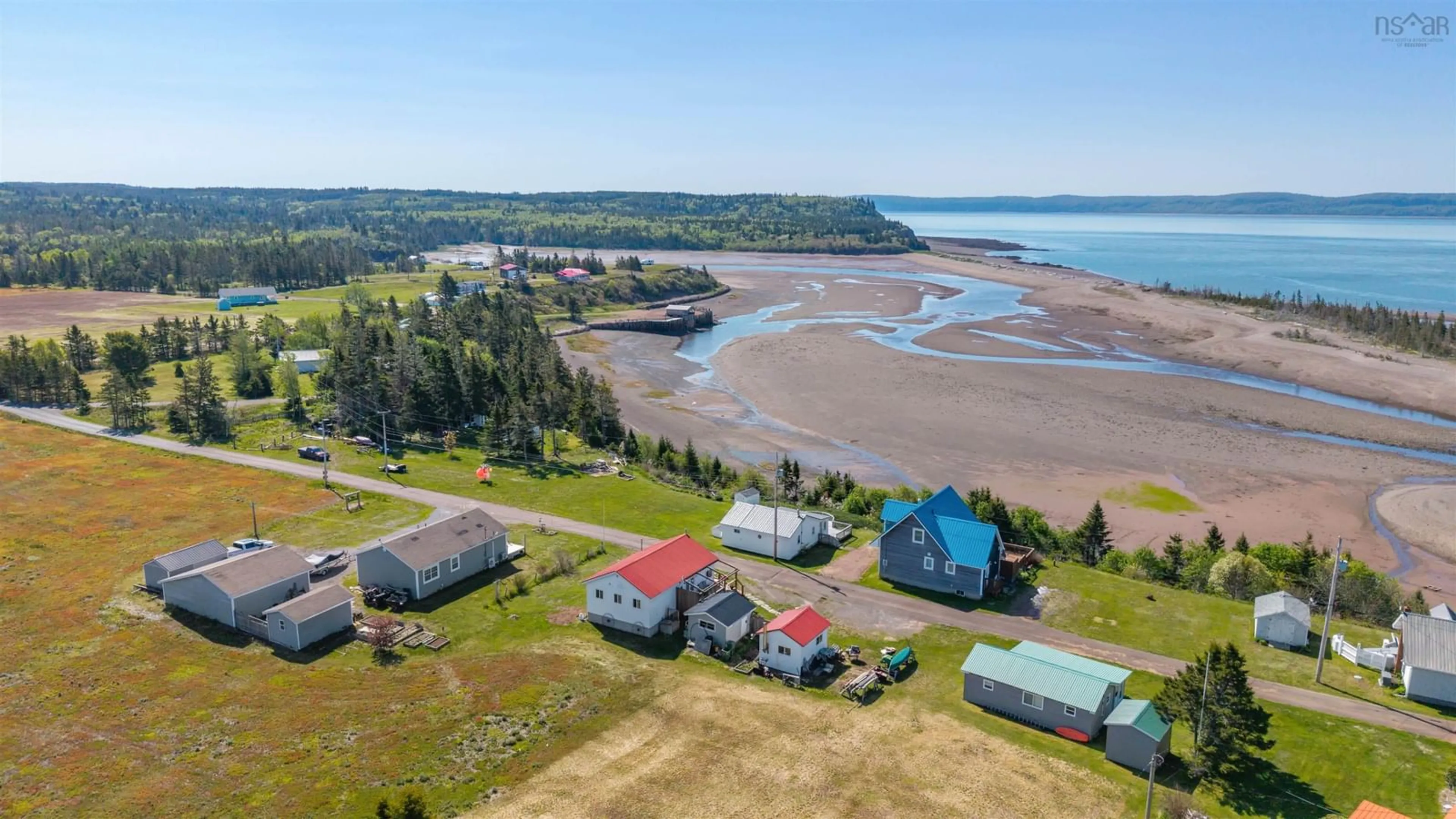 A pic from outside/outdoor area/front of a property/back of a property/a pic from drone, water/lake/river/ocean view for 243 Cottage Rd, Diligent River Nova Scotia B0M 1S0