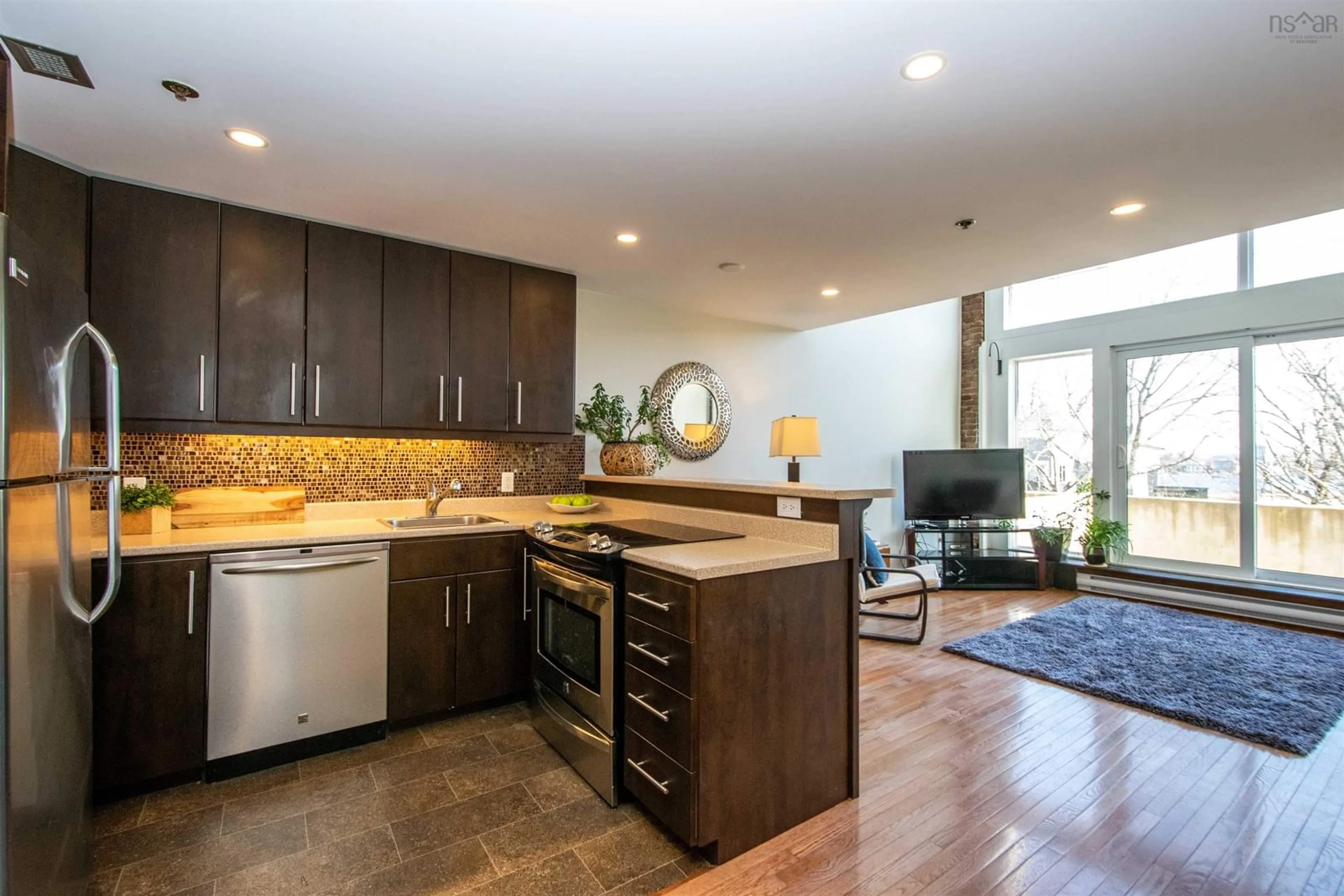 Open concept kitchen, wood/laminate floor for 2128 Brunswick St #10, Halifax Nova Scotia B3K 2Y8