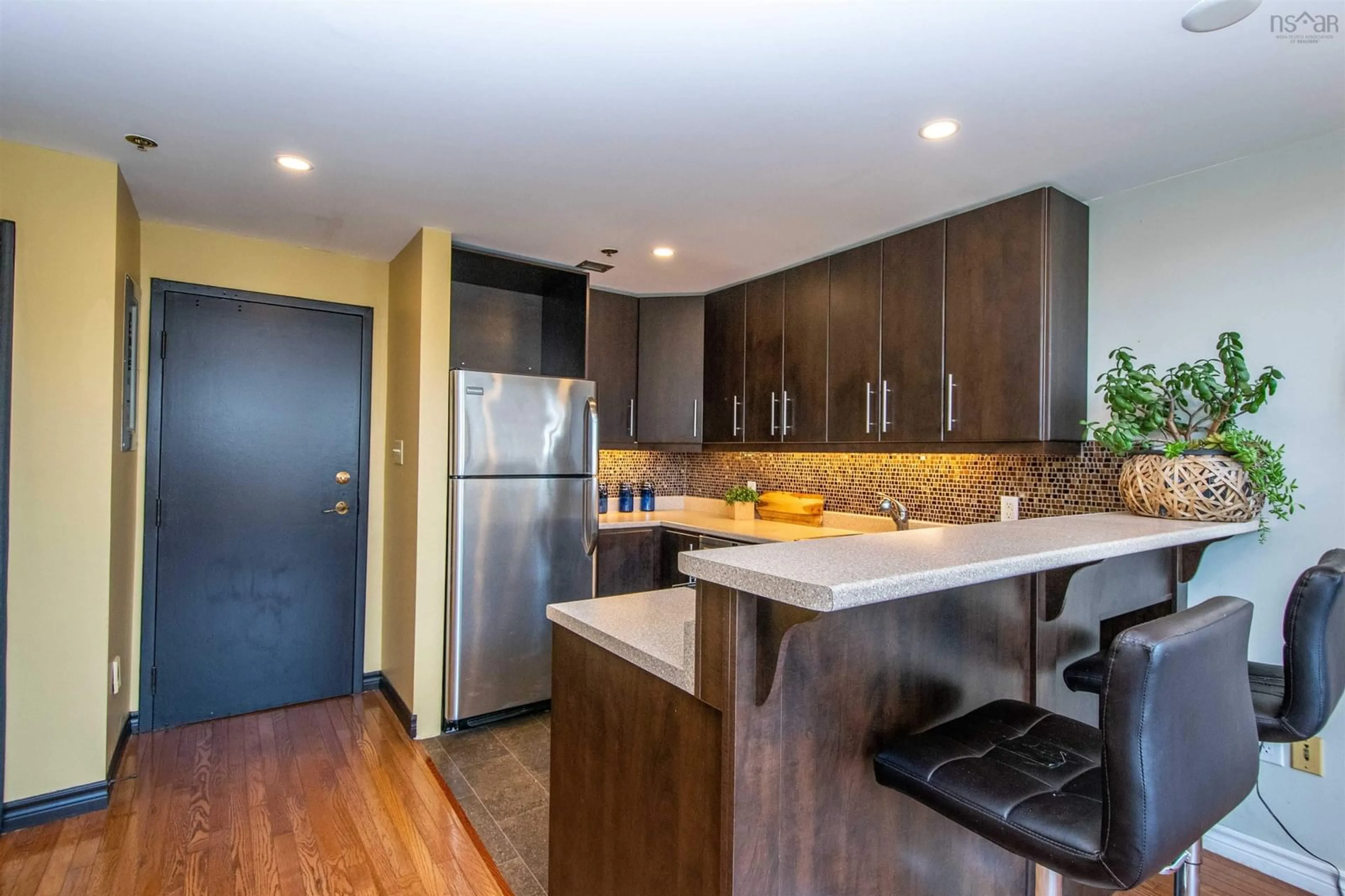 Open concept kitchen, wood/laminate floor for 2128 Brunswick St #10, Halifax Nova Scotia B3K 2Y8