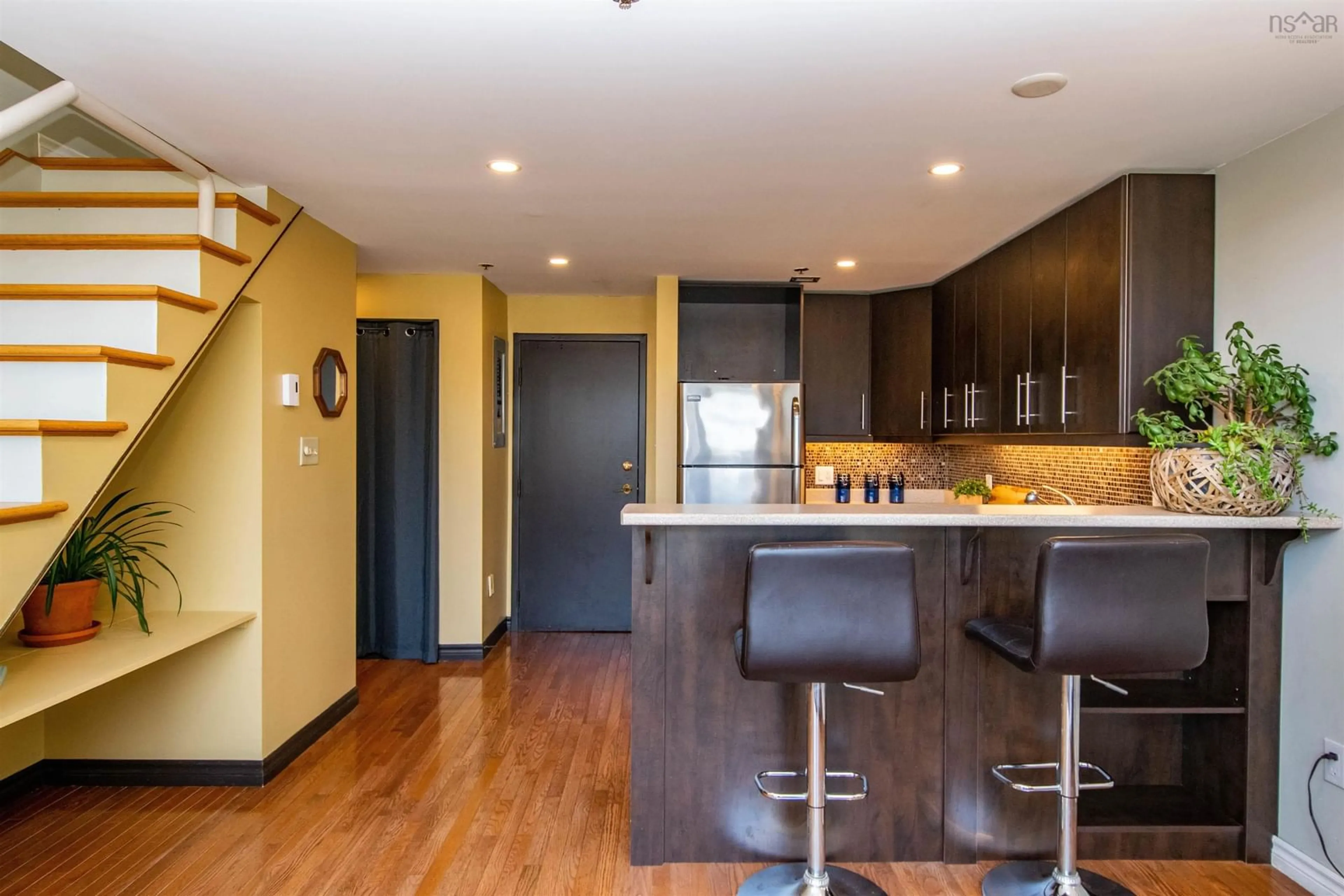 Open concept kitchen, wood/laminate floor for 2128 Brunswick St #10, Halifax Nova Scotia B3K 2Y8
