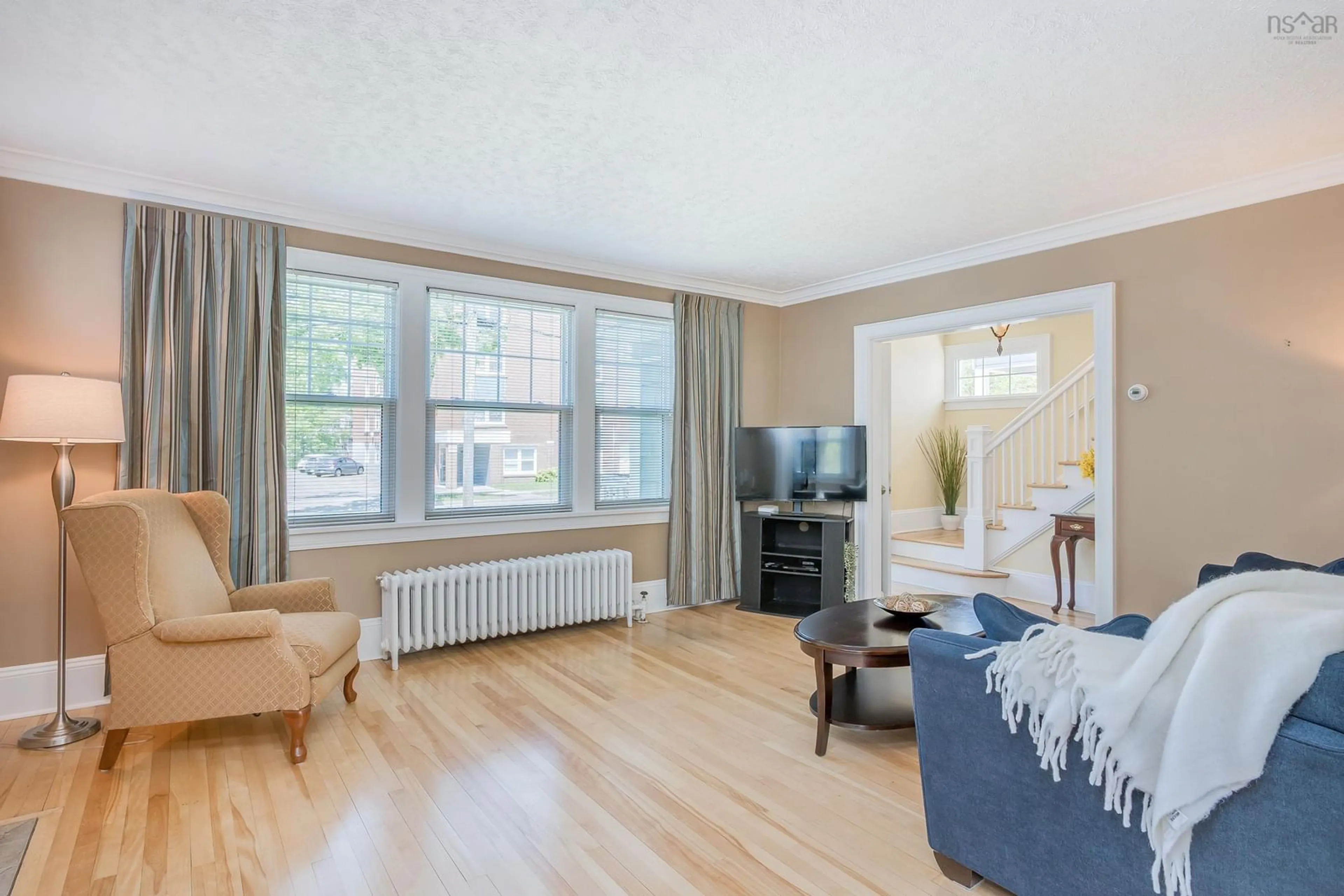 Living room with furniture, wood/laminate floor for 6076 Shirley St, Halifax Nova Scotia B3H 2M8