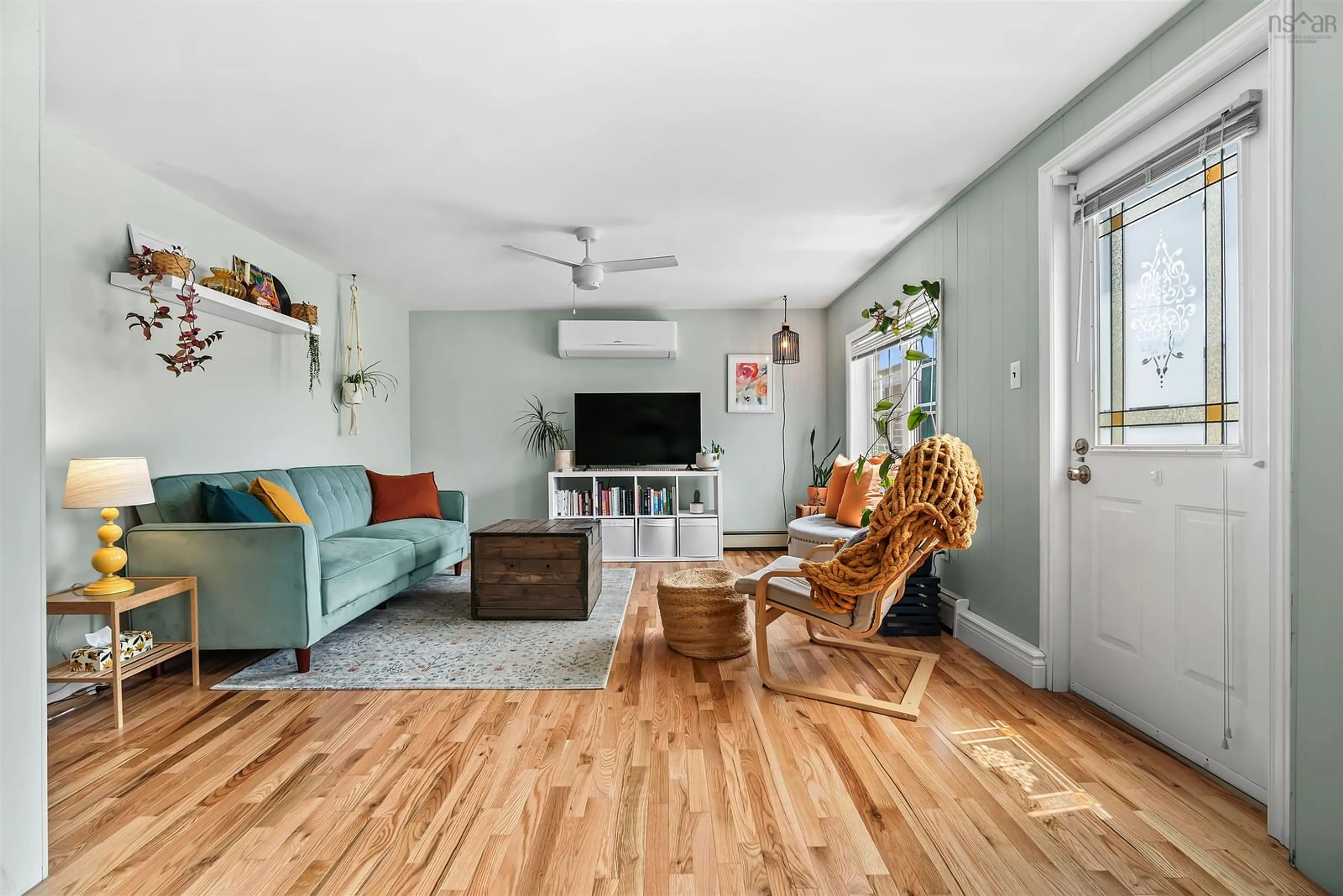 Living room with furniture, wood/laminate floor for 8 Harrie Dr, Terence Bay Nova Scotia B3T 1Y2