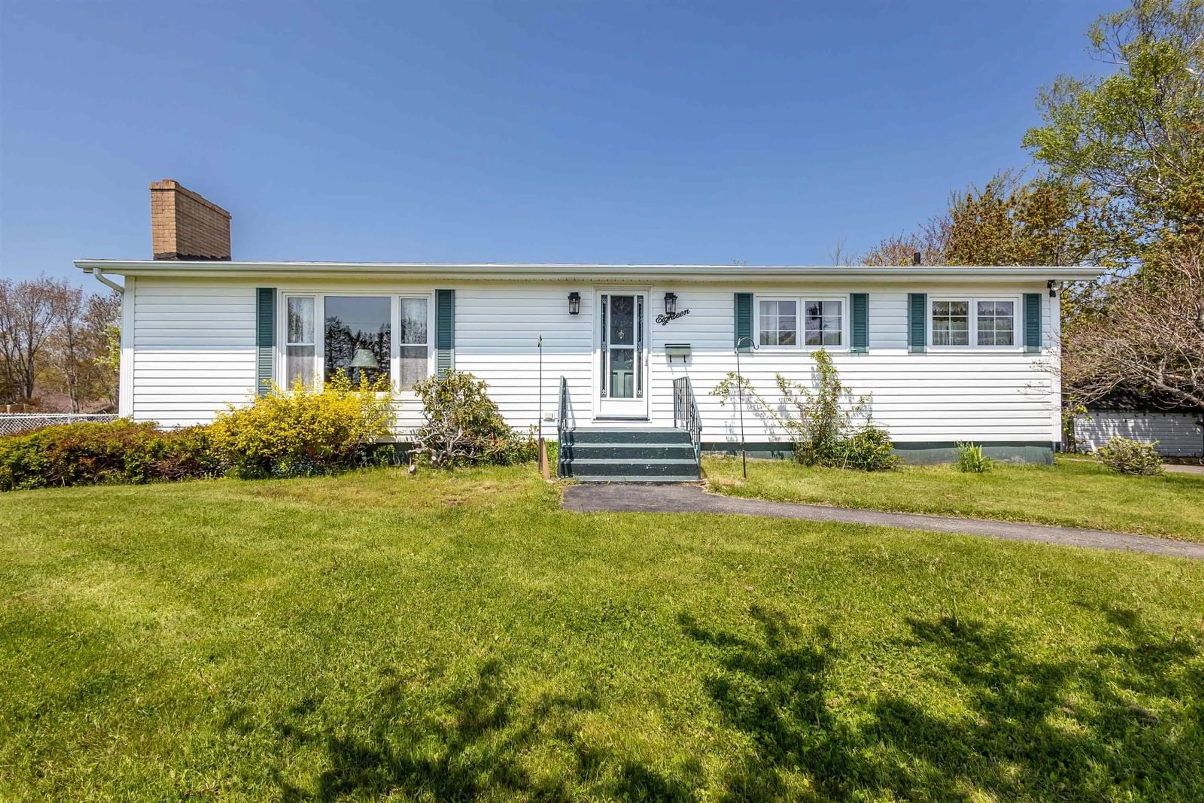 Home with vinyl exterior material, street for 18 Macnamara Ave, Coxheath Nova Scotia B1R 2C2
