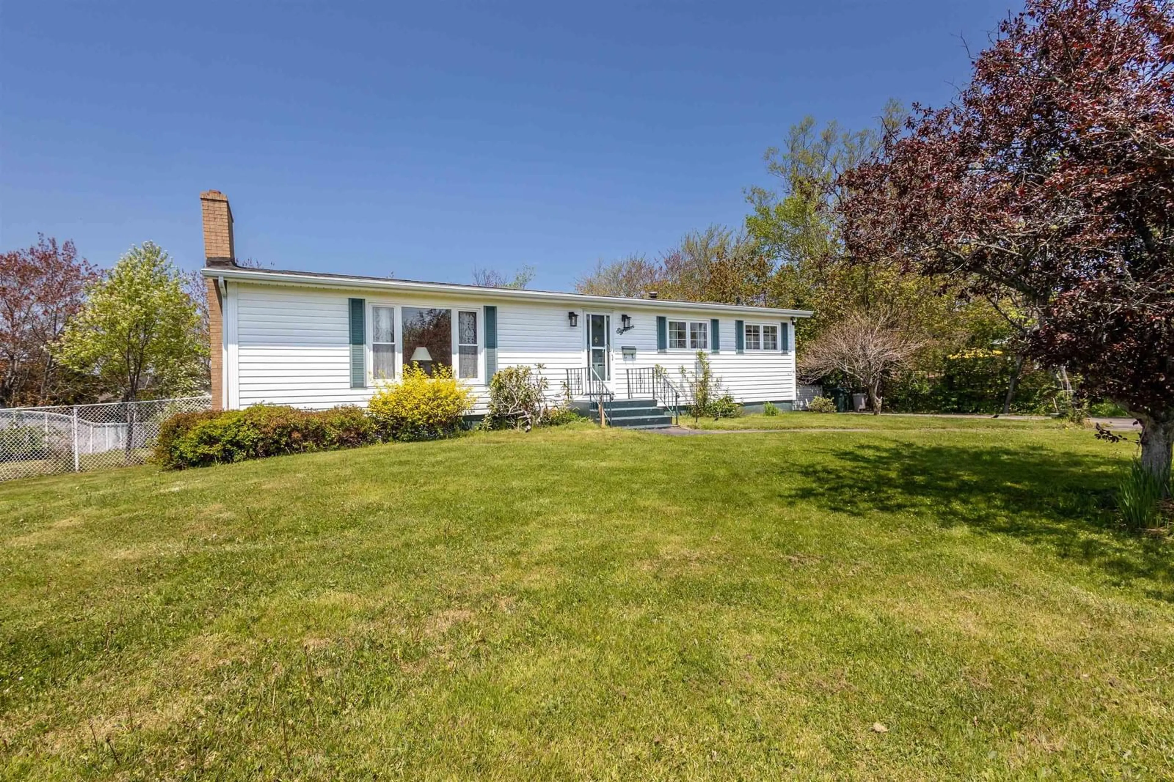 Home with vinyl exterior material, street for 18 Macnamara Ave, Coxheath Nova Scotia B1R 2C2