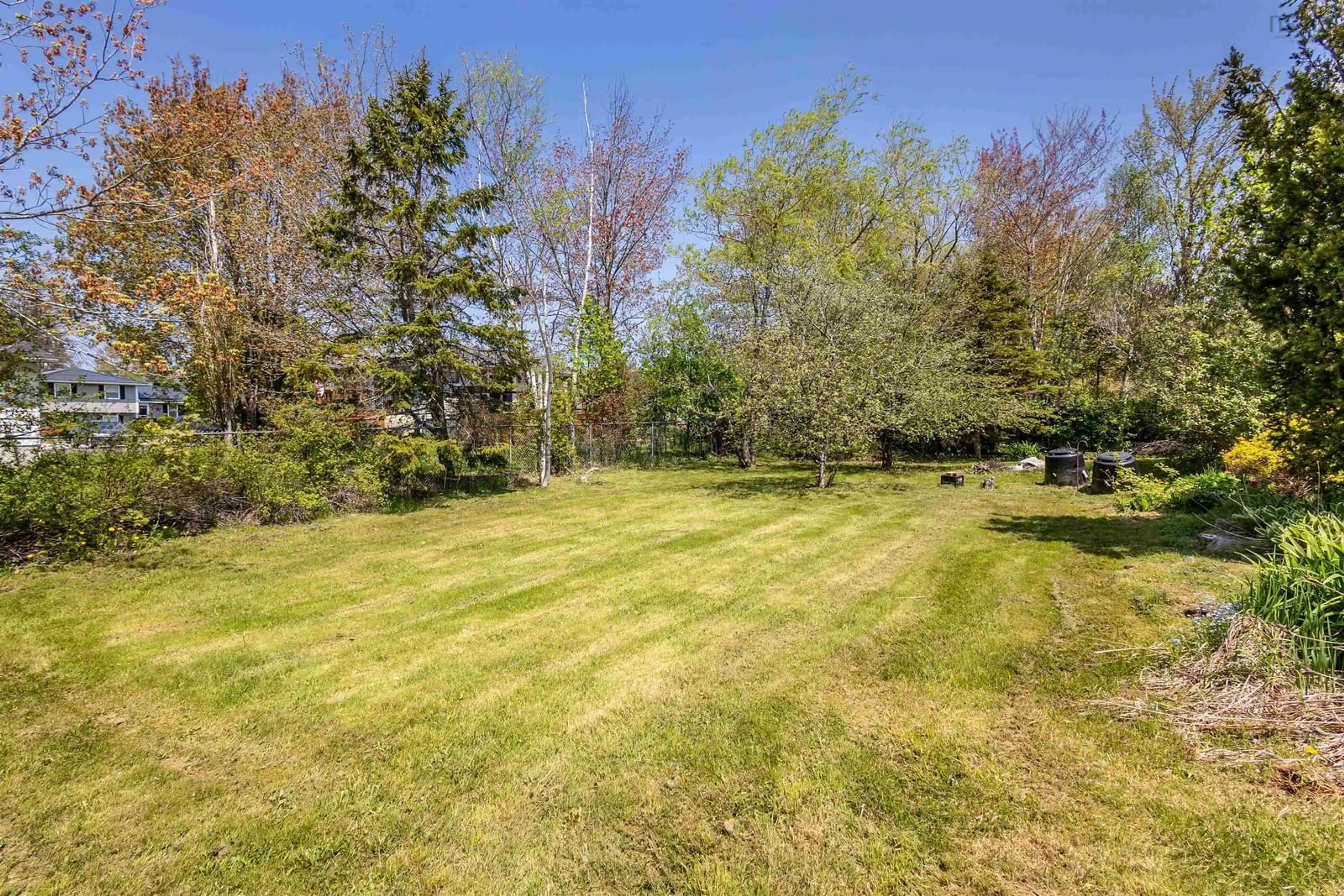 A pic from outside/outdoor area/front of a property/back of a property/a pic from drone, forest/trees view for 18 Macnamara Ave, Coxheath Nova Scotia B1R 2C2