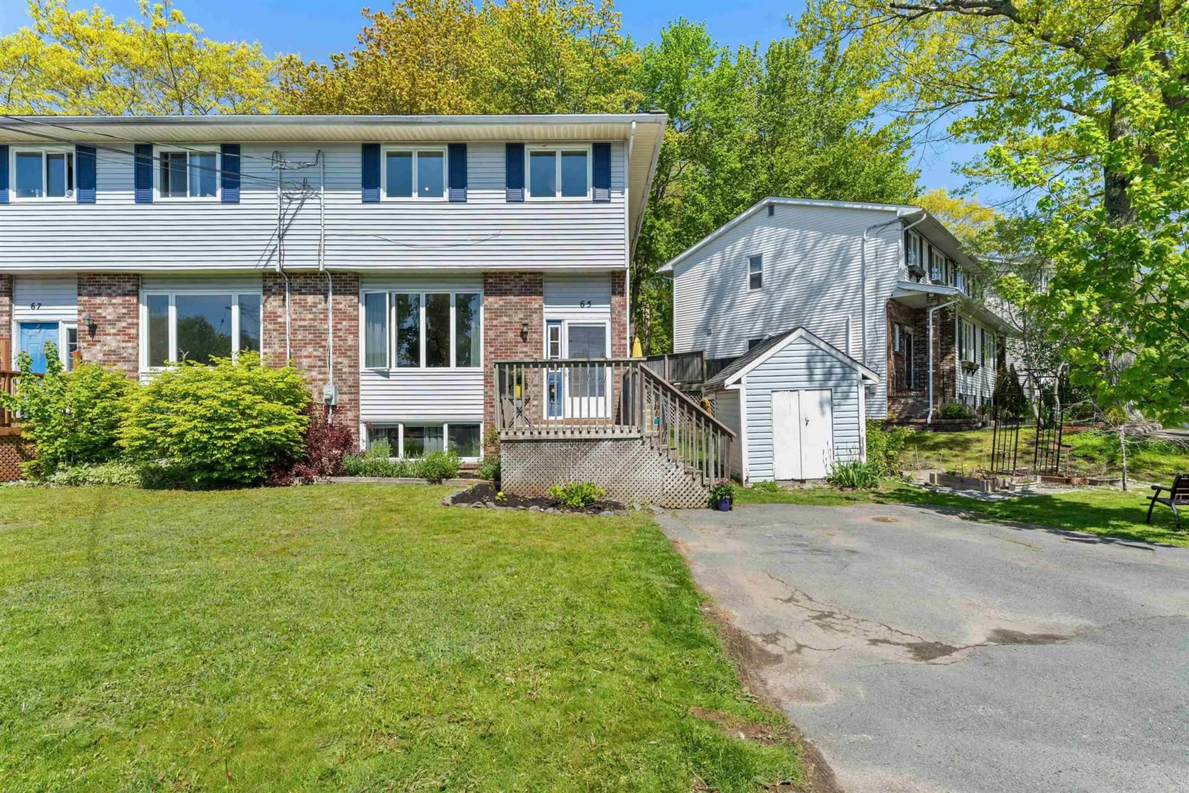 Home with vinyl exterior material, street for 65 Wynn Castle Dr, Lower Sackville Nova Scotia B4E 2H3