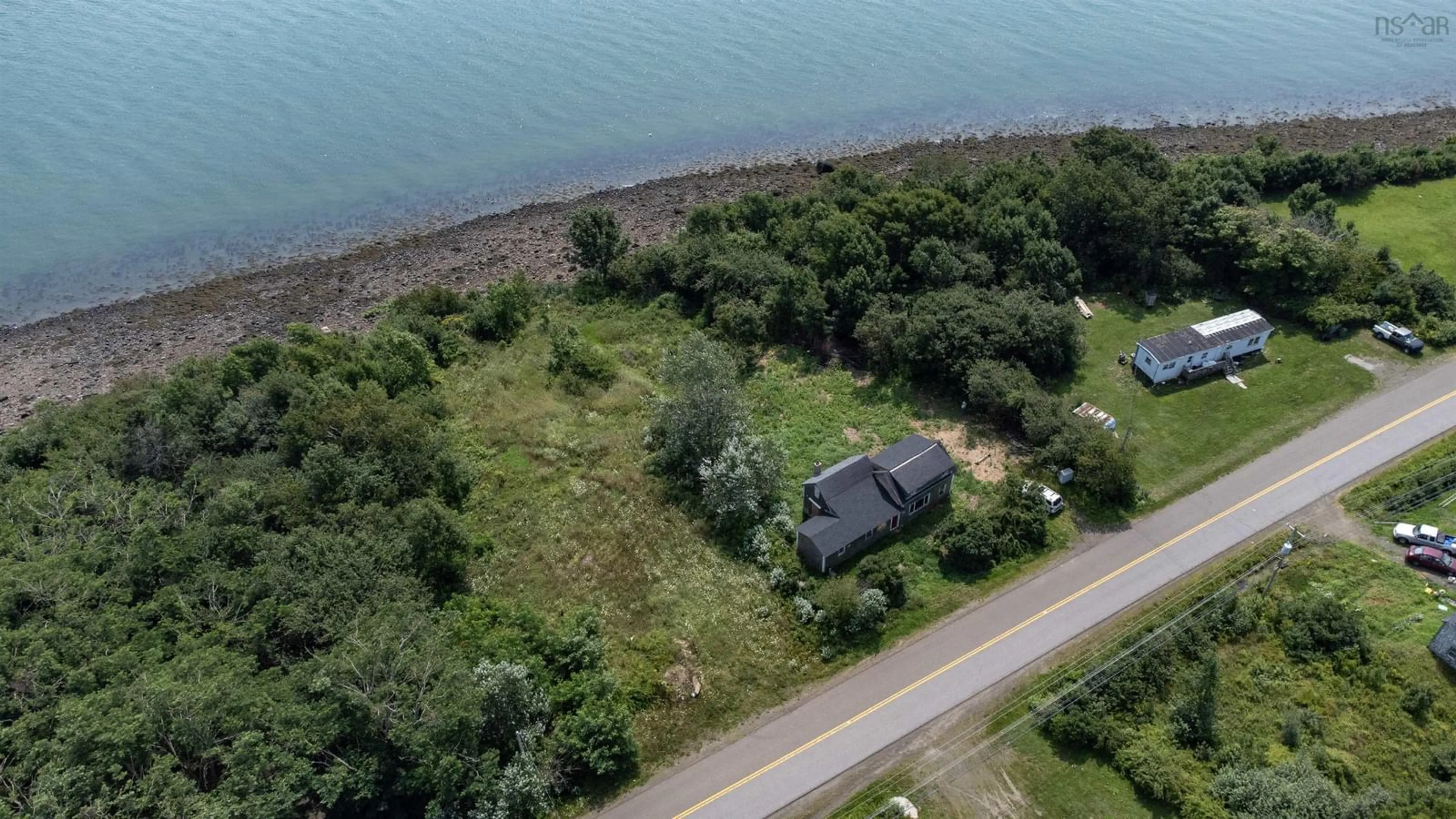 A pic from outside/outdoor area/front of a property/back of a property/a pic from drone, water/lake/river/ocean view for 1234 Granville Rd, Victoria Beach Nova Scotia B0S 1A0