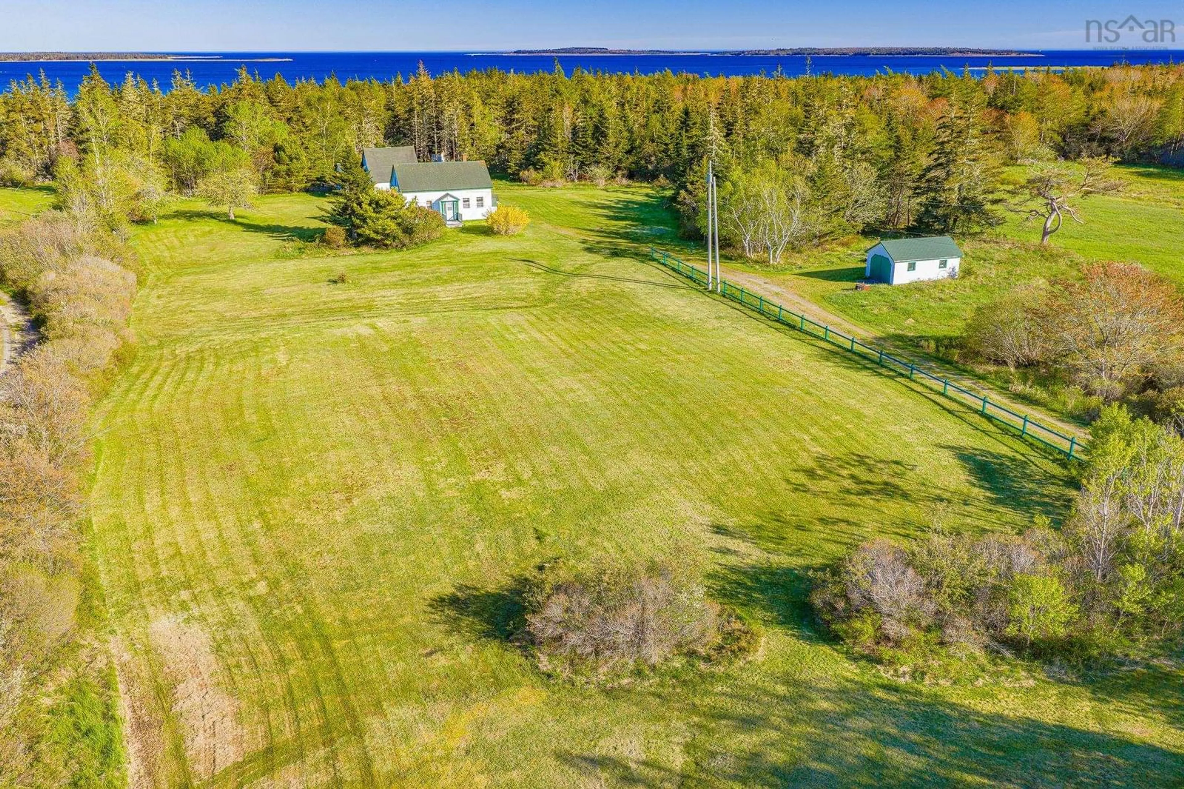 A pic from outside/outdoor area/front of a property/back of a property/a pic from drone, water/lake/river/ocean view for 4873 Shore Rd, North East Harbour Nova Scotia B0T 1W0