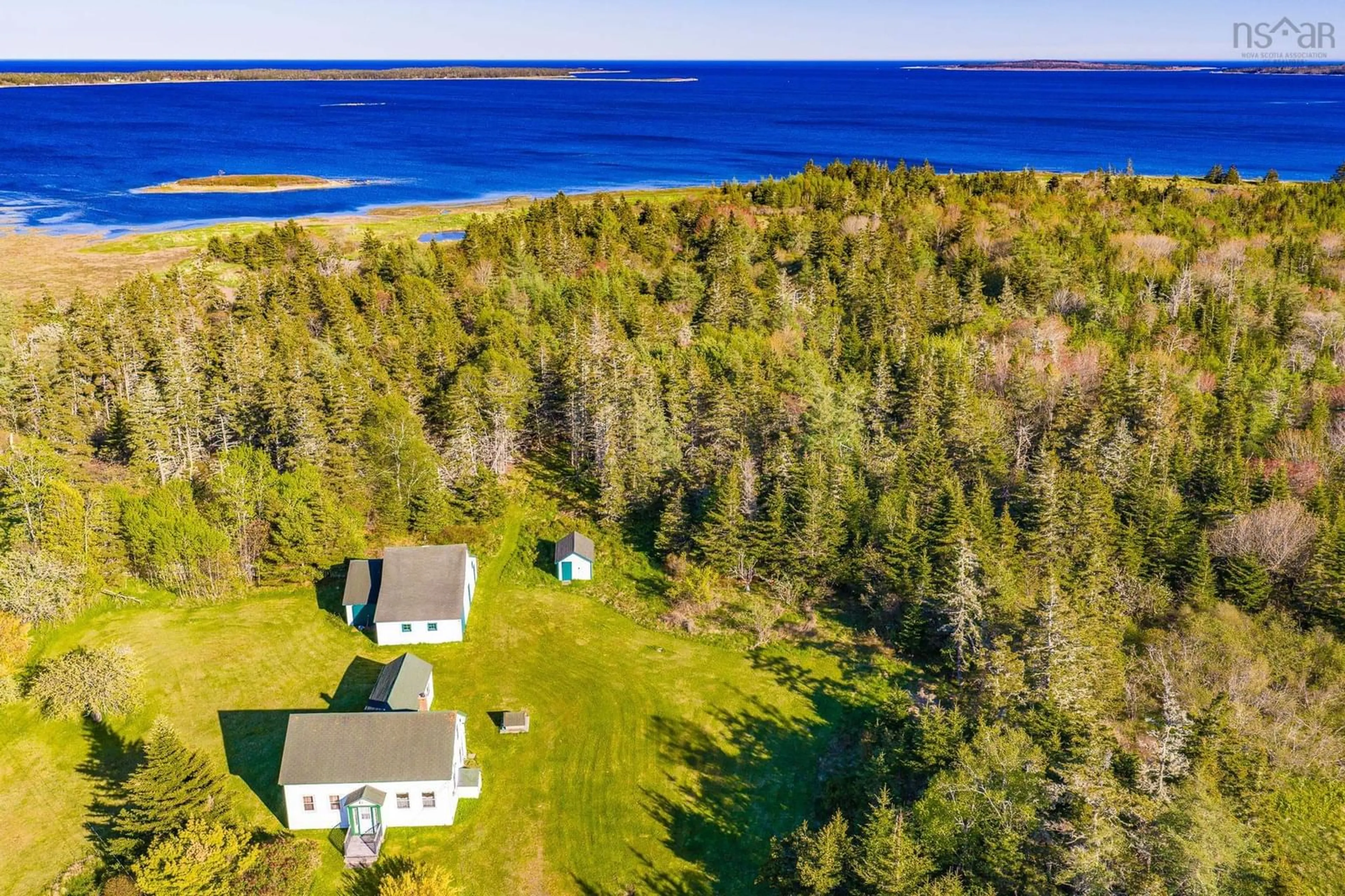 A pic from outside/outdoor area/front of a property/back of a property/a pic from drone, water/lake/river/ocean view for 4873 Shore Rd, North East Harbour Nova Scotia B0T 1W0