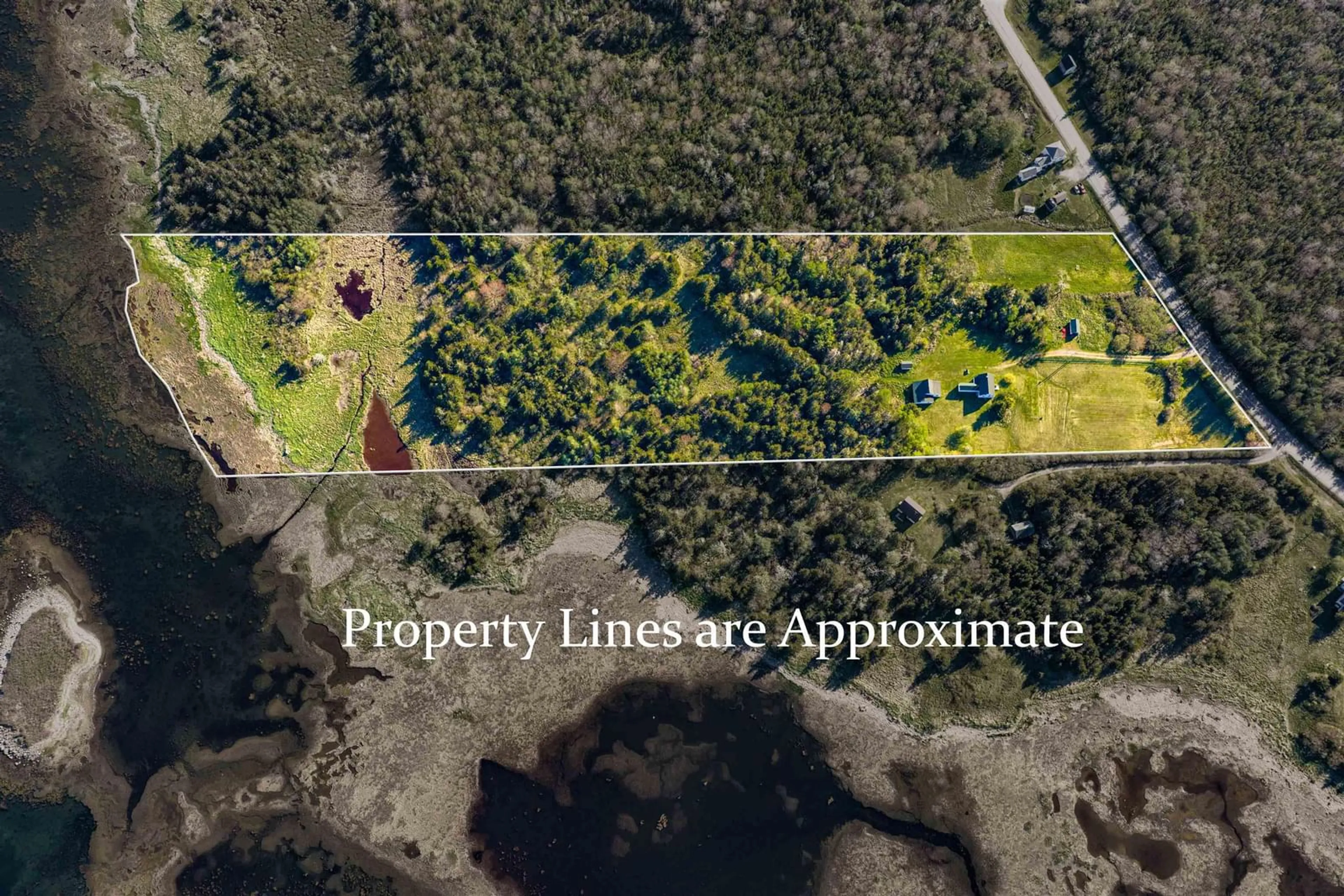 A pic from outside/outdoor area/front of a property/back of a property/a pic from drone, forest/trees view for 4873 Shore Rd, North East Harbour Nova Scotia B0T 1W0