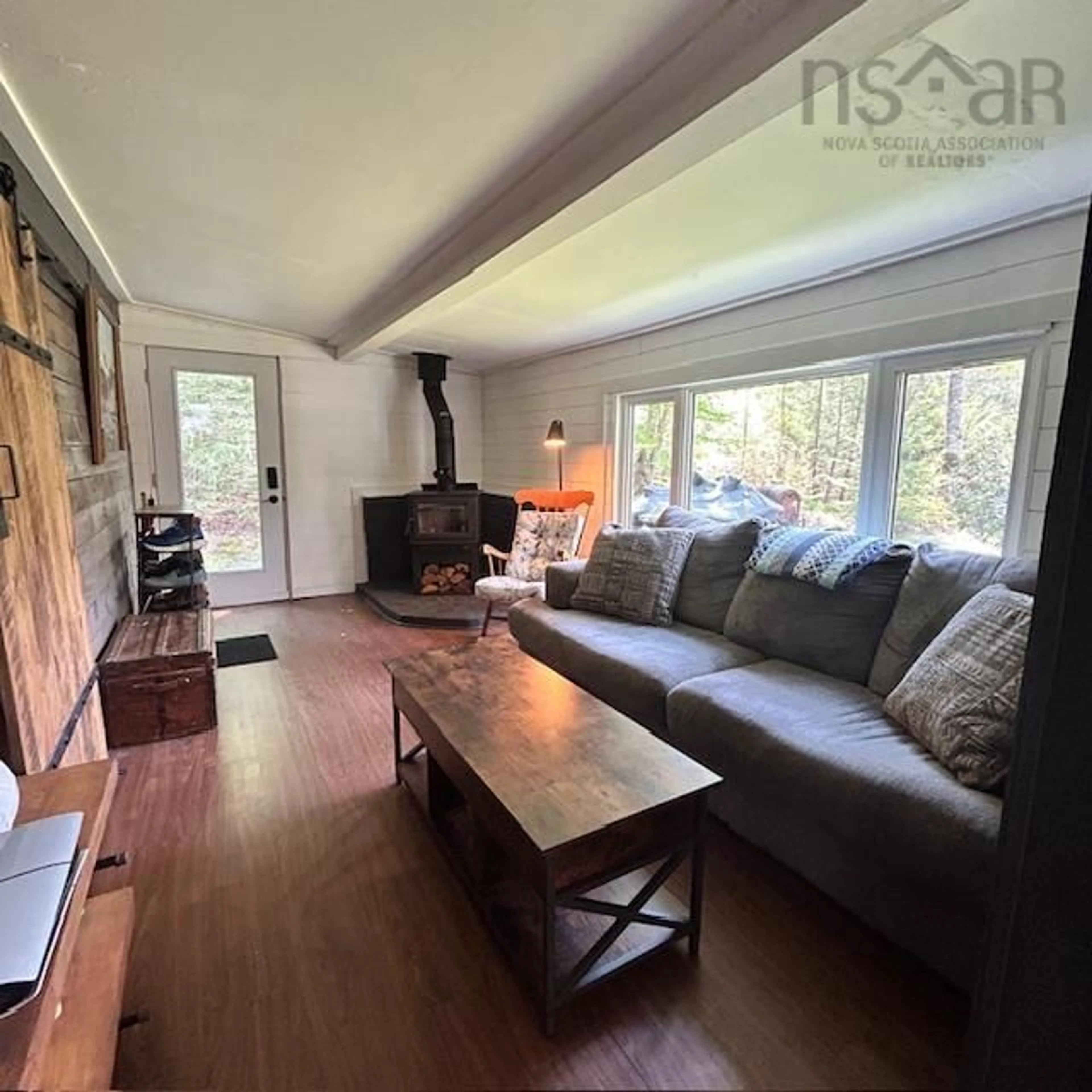 Living room with furniture, wood/laminate floor for 61 Horseback Hideaway, Labelle Nova Scotia B0T 1E0
