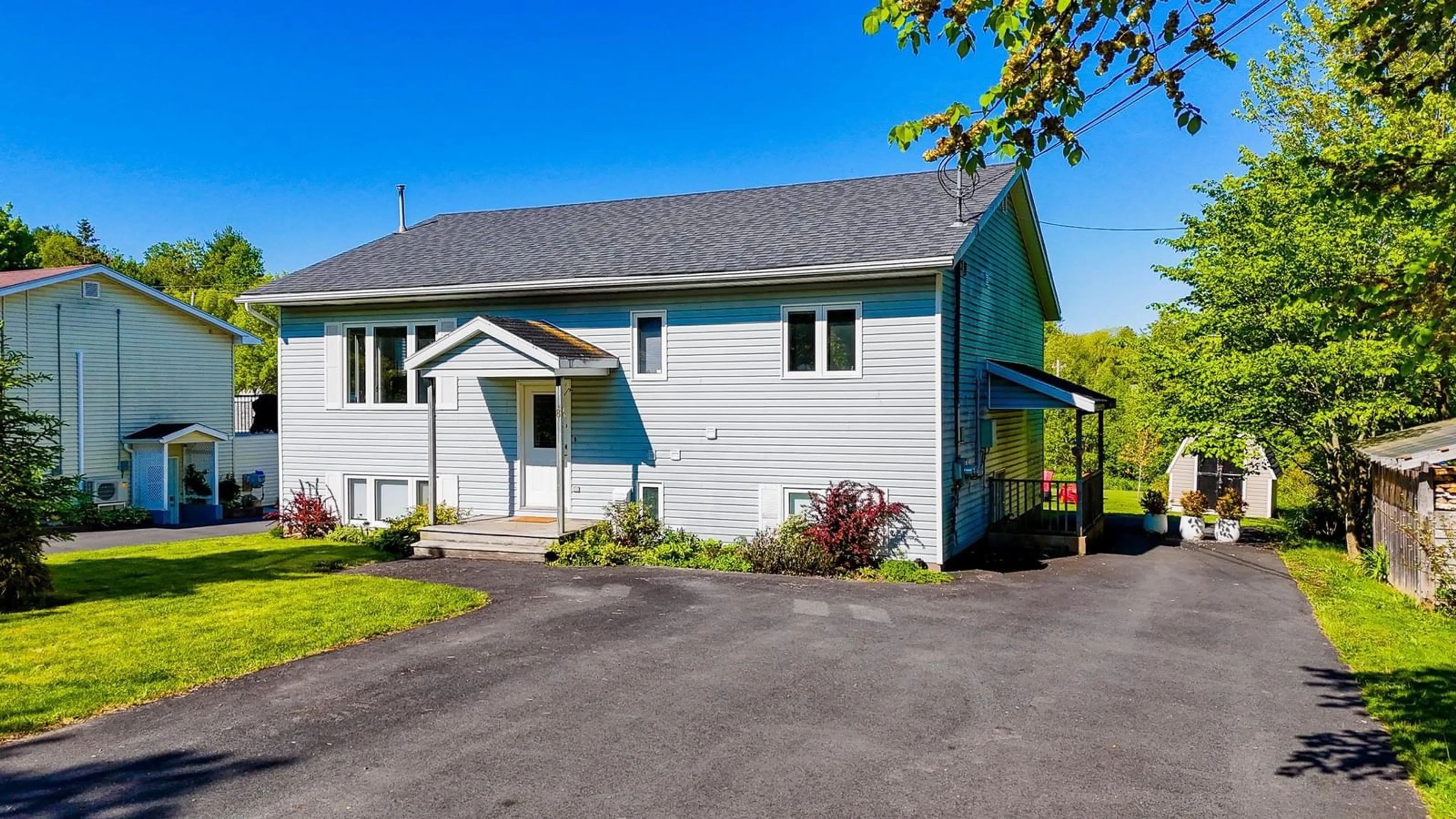 Home with vinyl exterior material, street for 8 Iona Rd, Wolfville Nova Scotia B4P 2H1