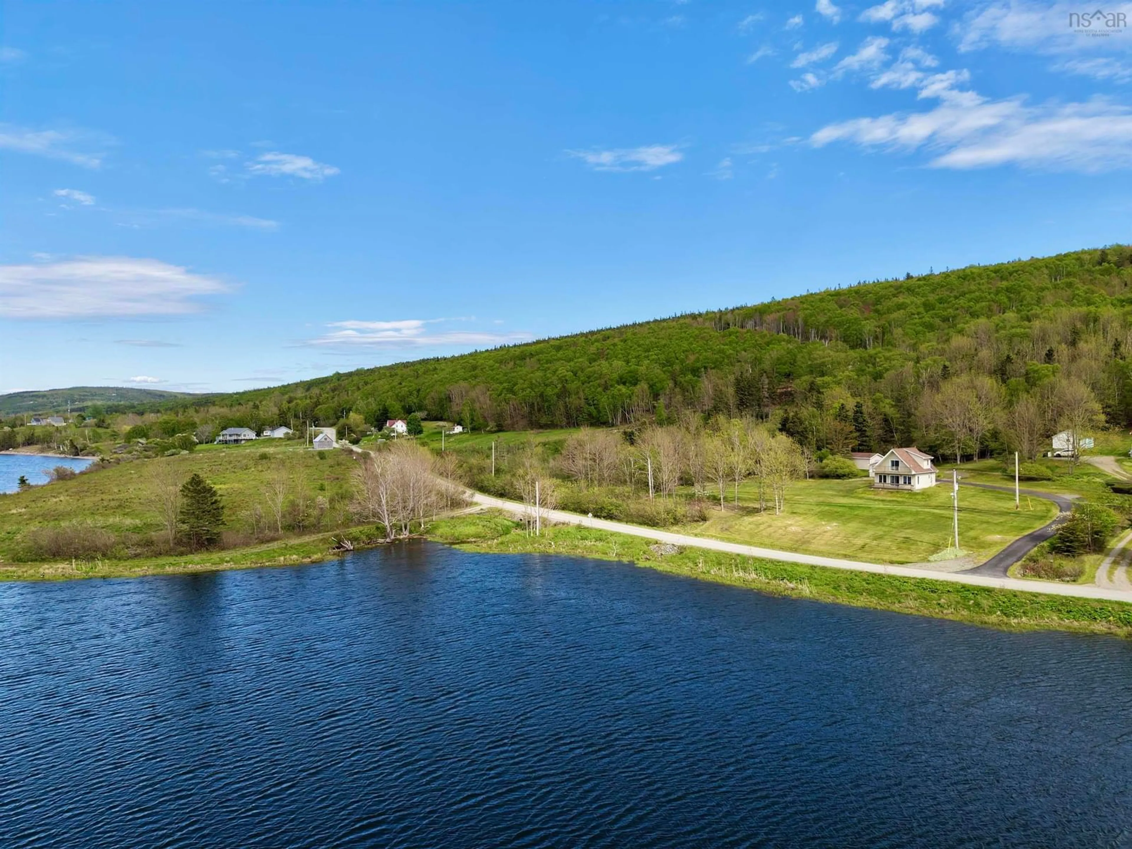 A pic from outside/outdoor area/front of a property/back of a property/a pic from drone, water/lake/river/ocean view for 3200 West Bay Rd., St George's Channel Nova Scotia B0E 3K0