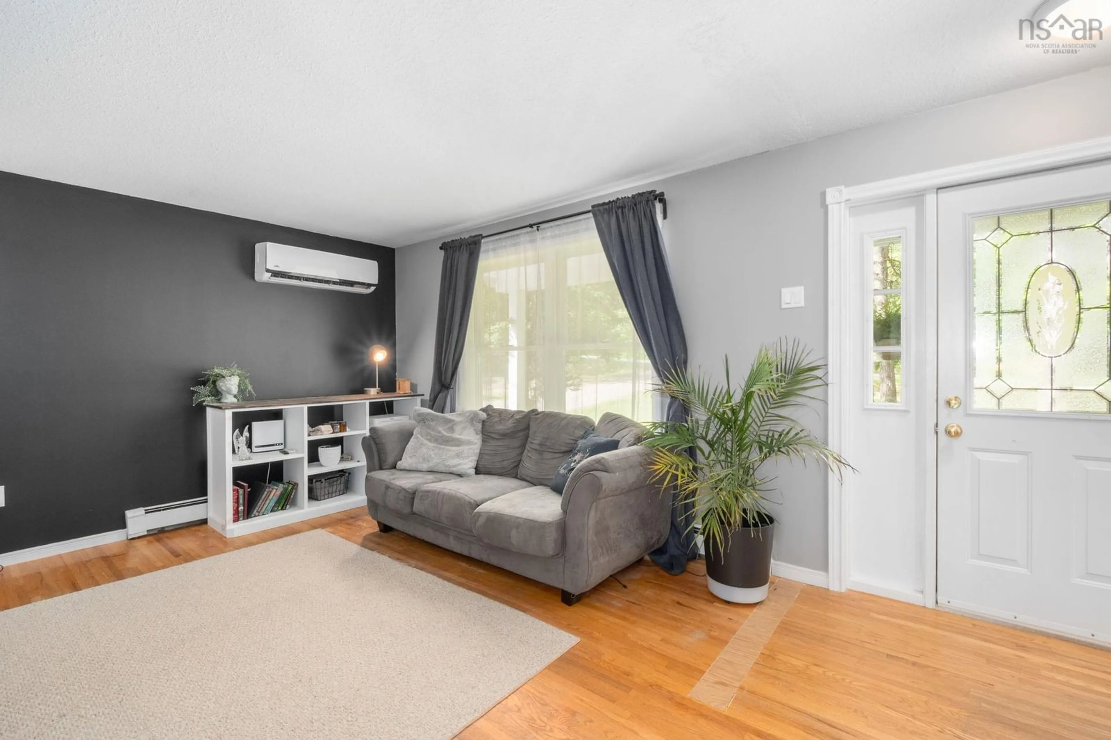 Living room with furniture, wood/laminate floor for 1860 Gerald Dr, Coldbrook Nova Scotia B4R 1A3