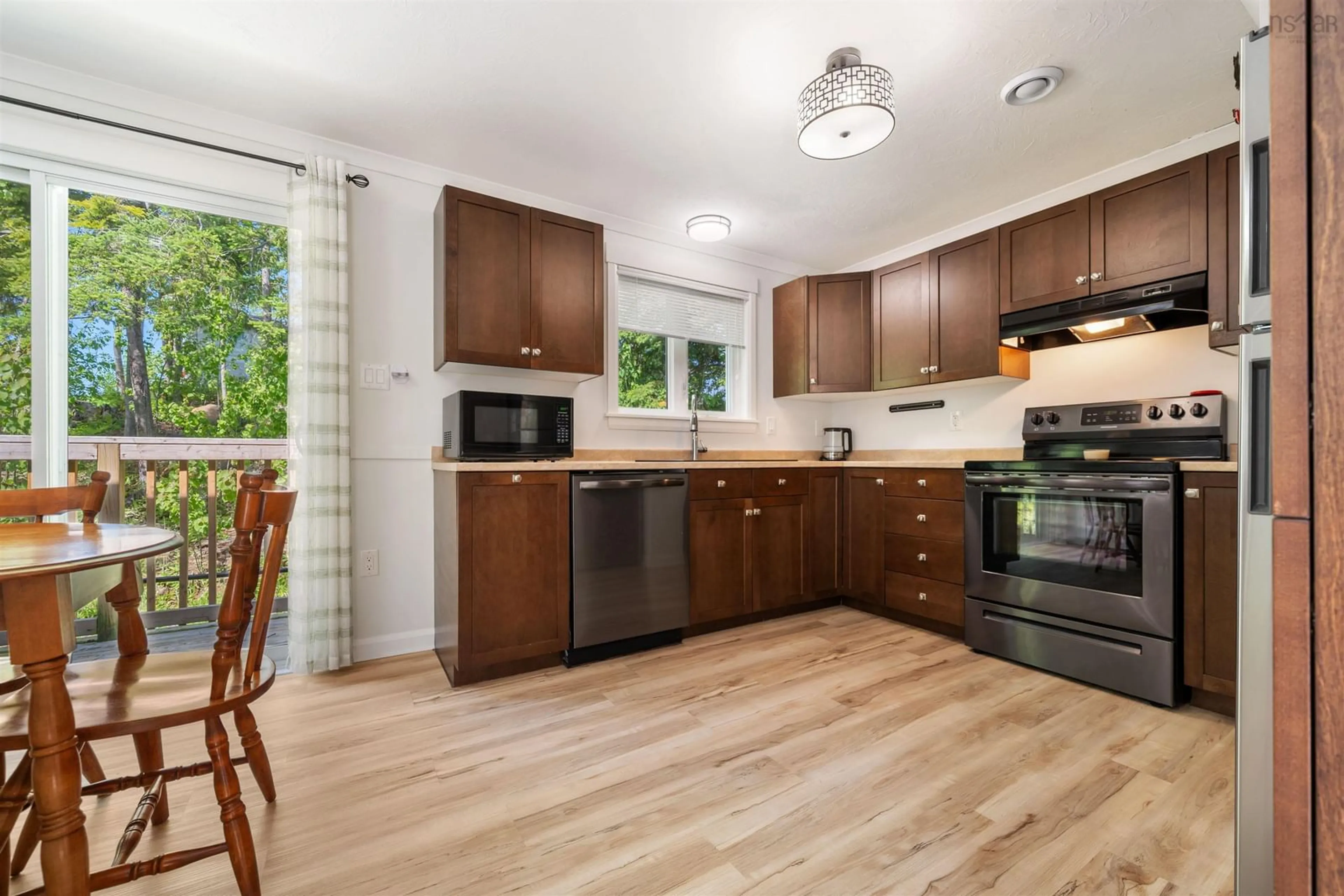 Open concept kitchen, wood/laminate floor for 11 Shore Lane, Little Harbour Nova Scotia B2H 5C4