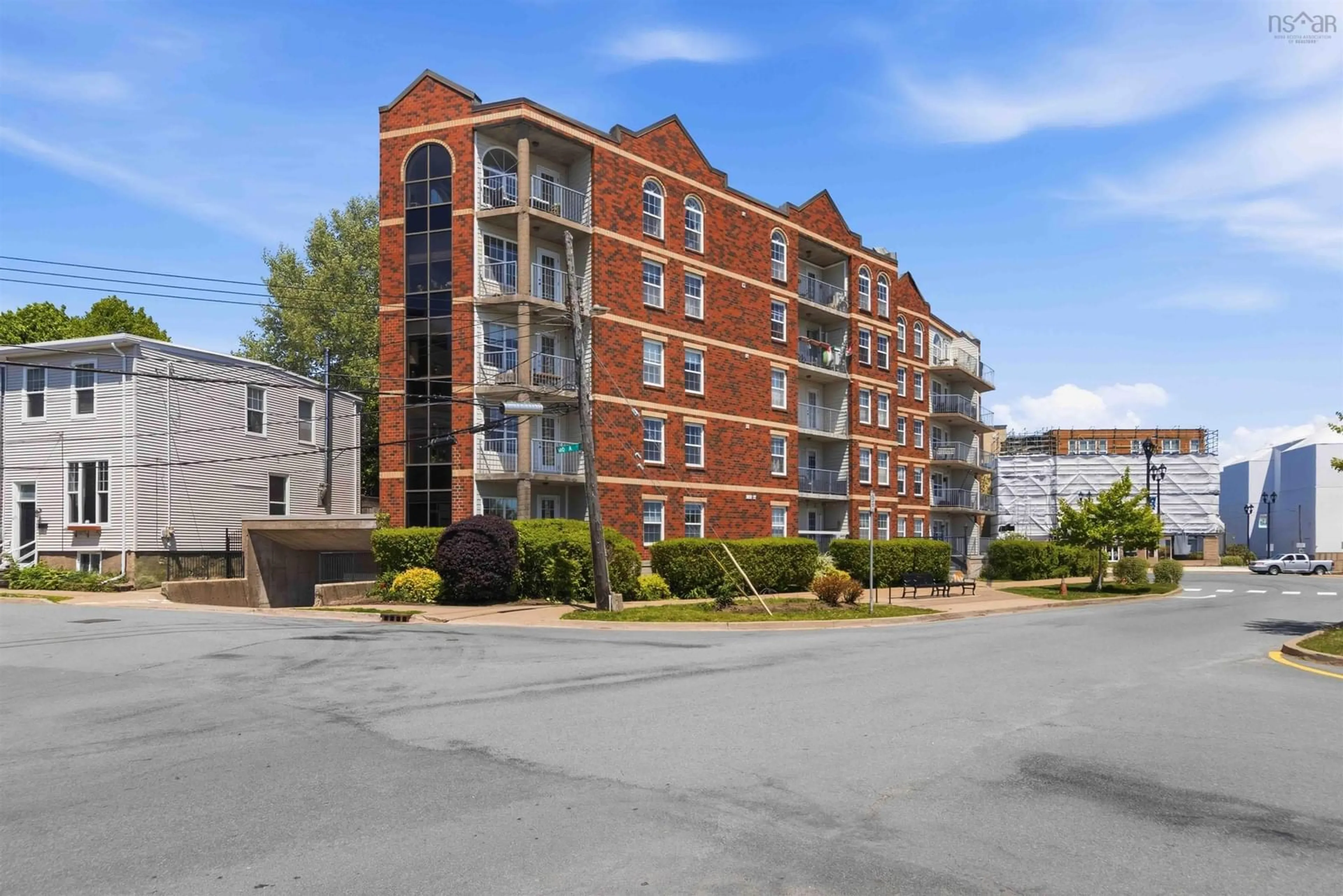 A pic from outside/outdoor area/front of a property/back of a property/a pic from drone, building for 5769 Cunard St #303, Halifax Nova Scotia B3K 1C8