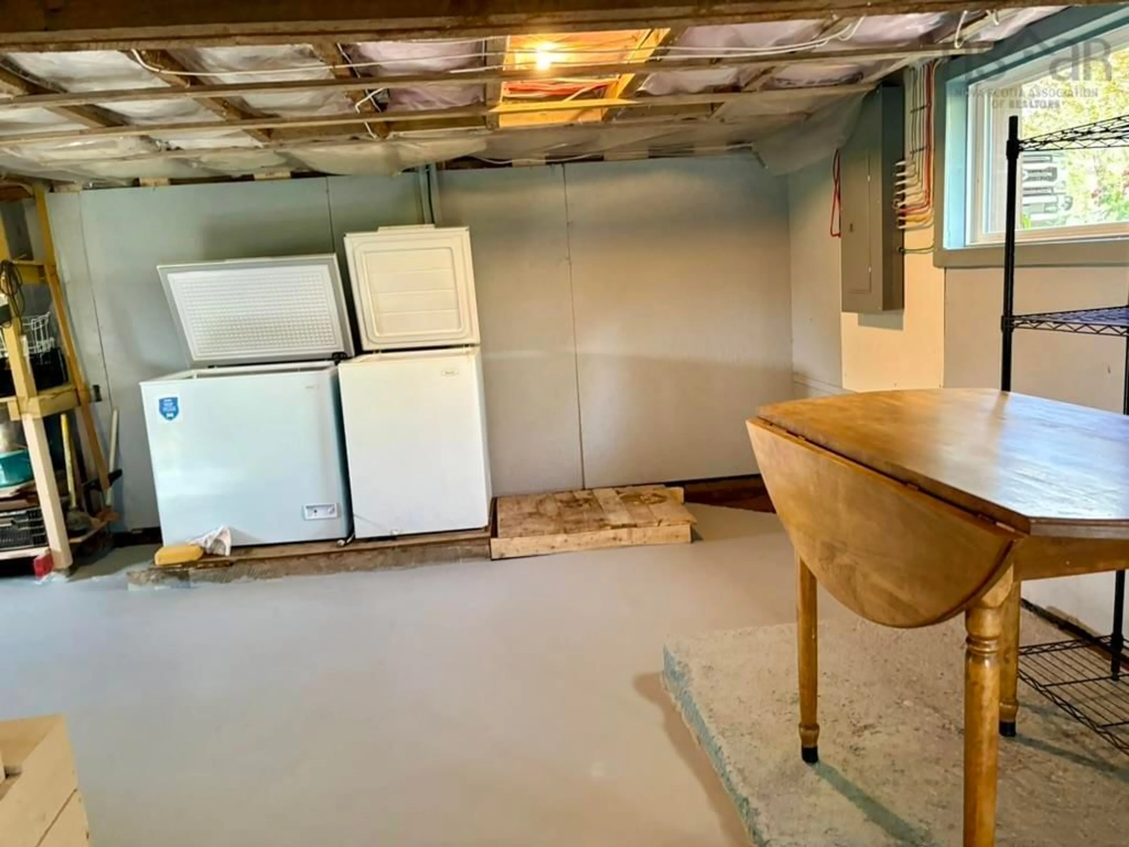 Kitchen with laundary machines, cement floor for 1302 Ridge Rd, Wolfville Nova Scotia B4P 0M4