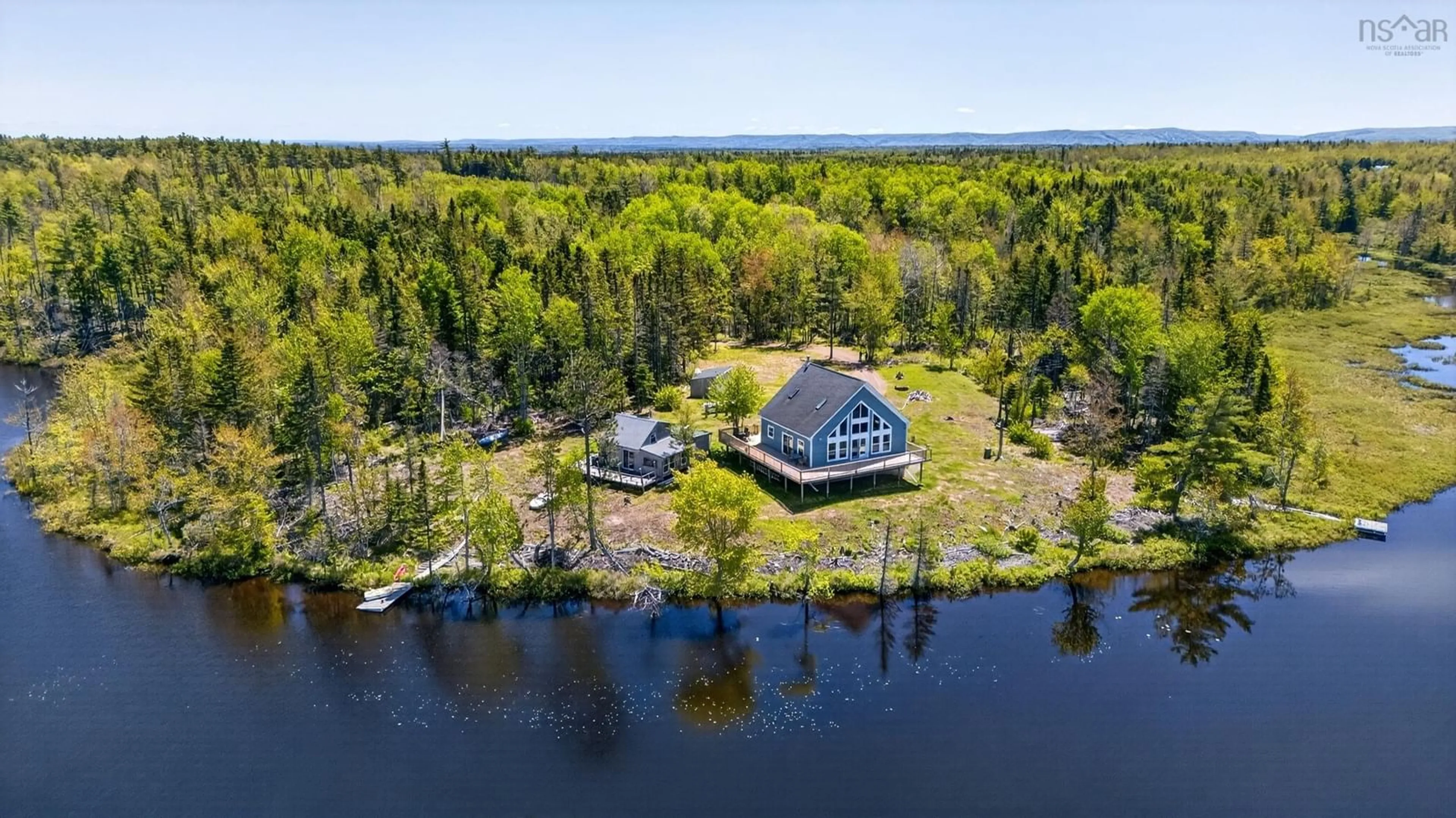 A pic from outside/outdoor area/front of a property/back of a property/a pic from drone, water/lake/river/ocean view for 855 Highway 368, Streets Ridge Nova Scotia B0M 1P0
