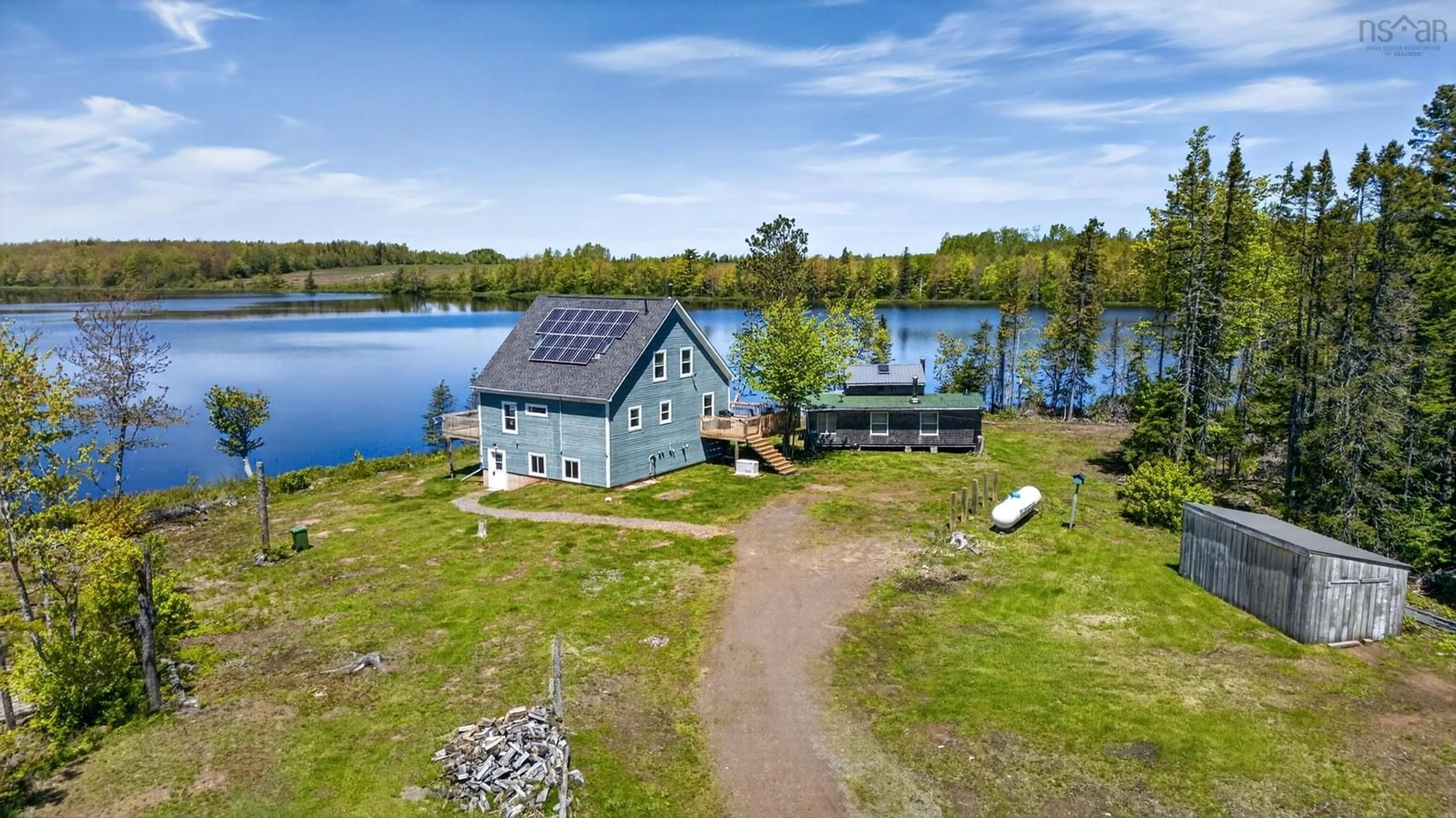 A pic from outside/outdoor area/front of a property/back of a property/a pic from drone, water/lake/river/ocean view for 855 Highway 368, Streets Ridge Nova Scotia B0M 1P0