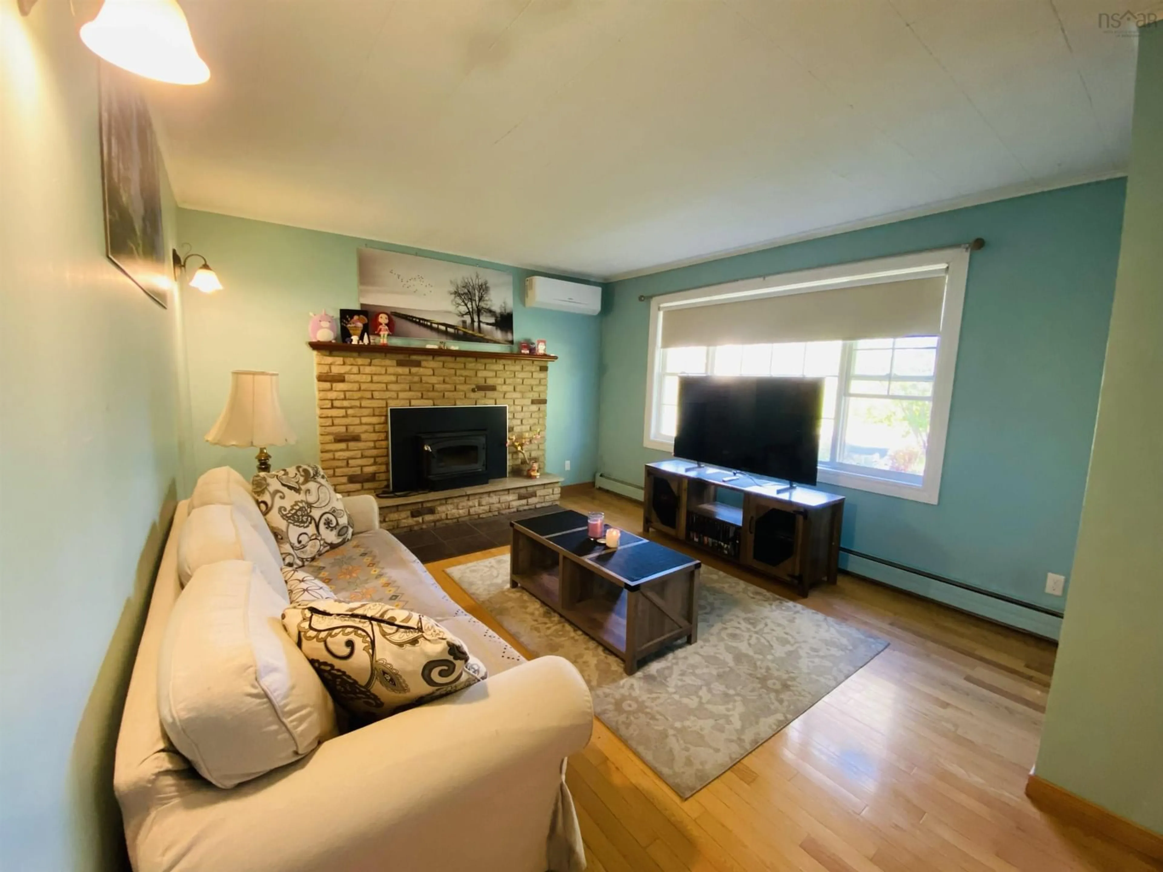 Living room with furniture, wood/laminate floor for 66 Ingrahams Lane, Westmount Nova Scotia B1R 1M3