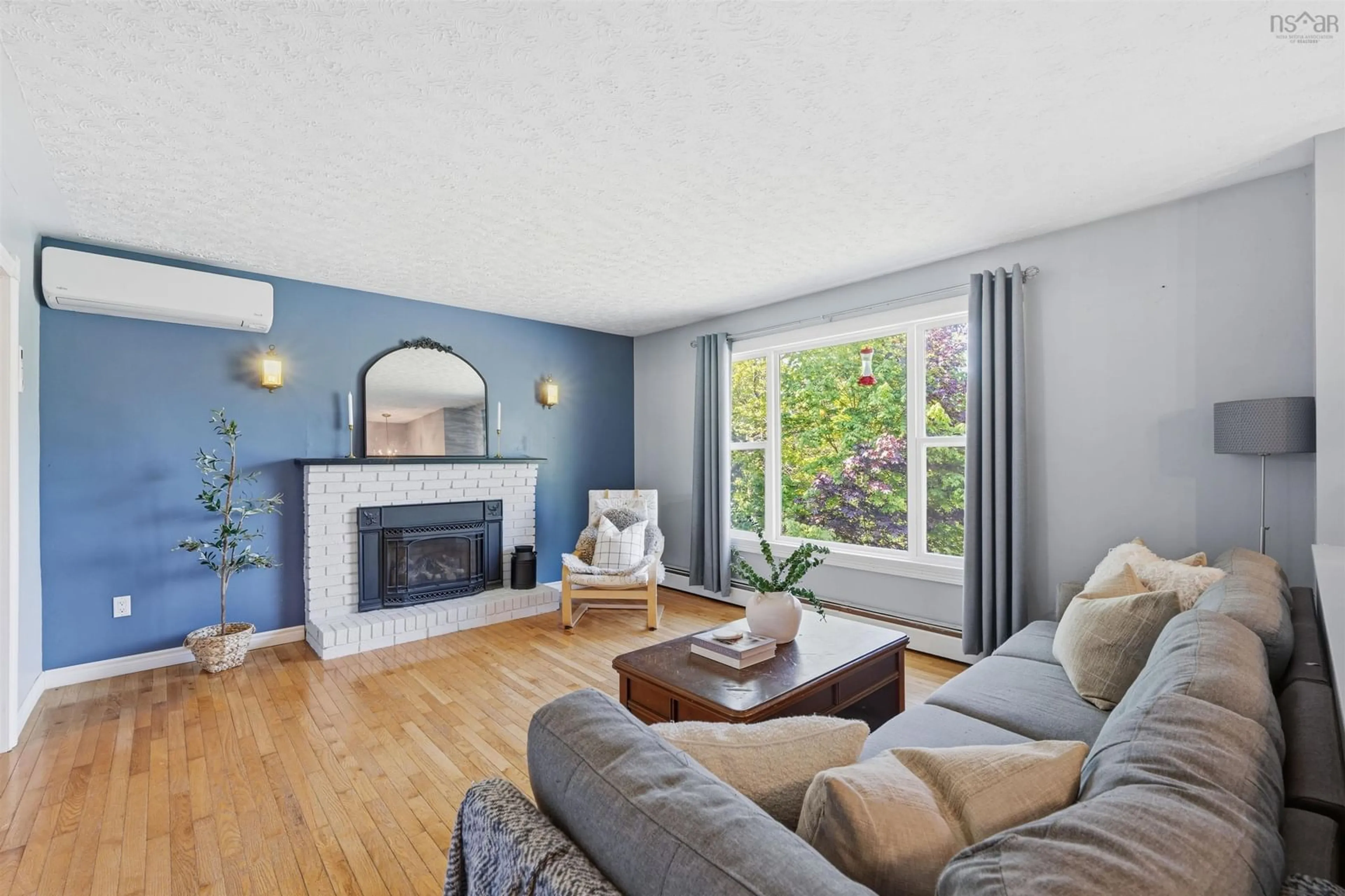 Living room with furniture, wood/laminate floor for 62 Marie Avenue Ave, Lake Echo Nova Scotia B3E 1A9