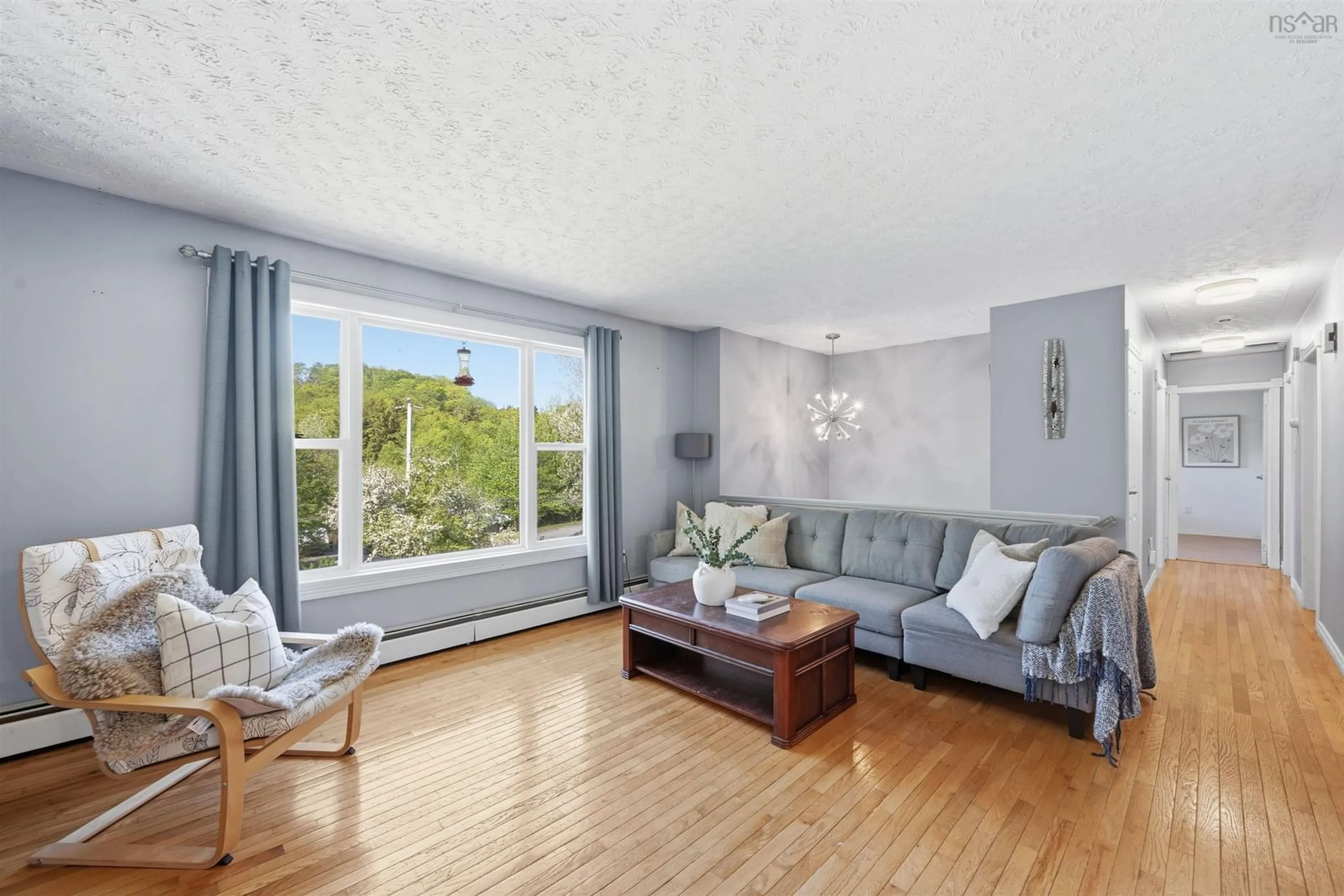 Living room with furniture, wood/laminate floor for 62 Marie Avenue Ave, Lake Echo Nova Scotia B3E 1A9