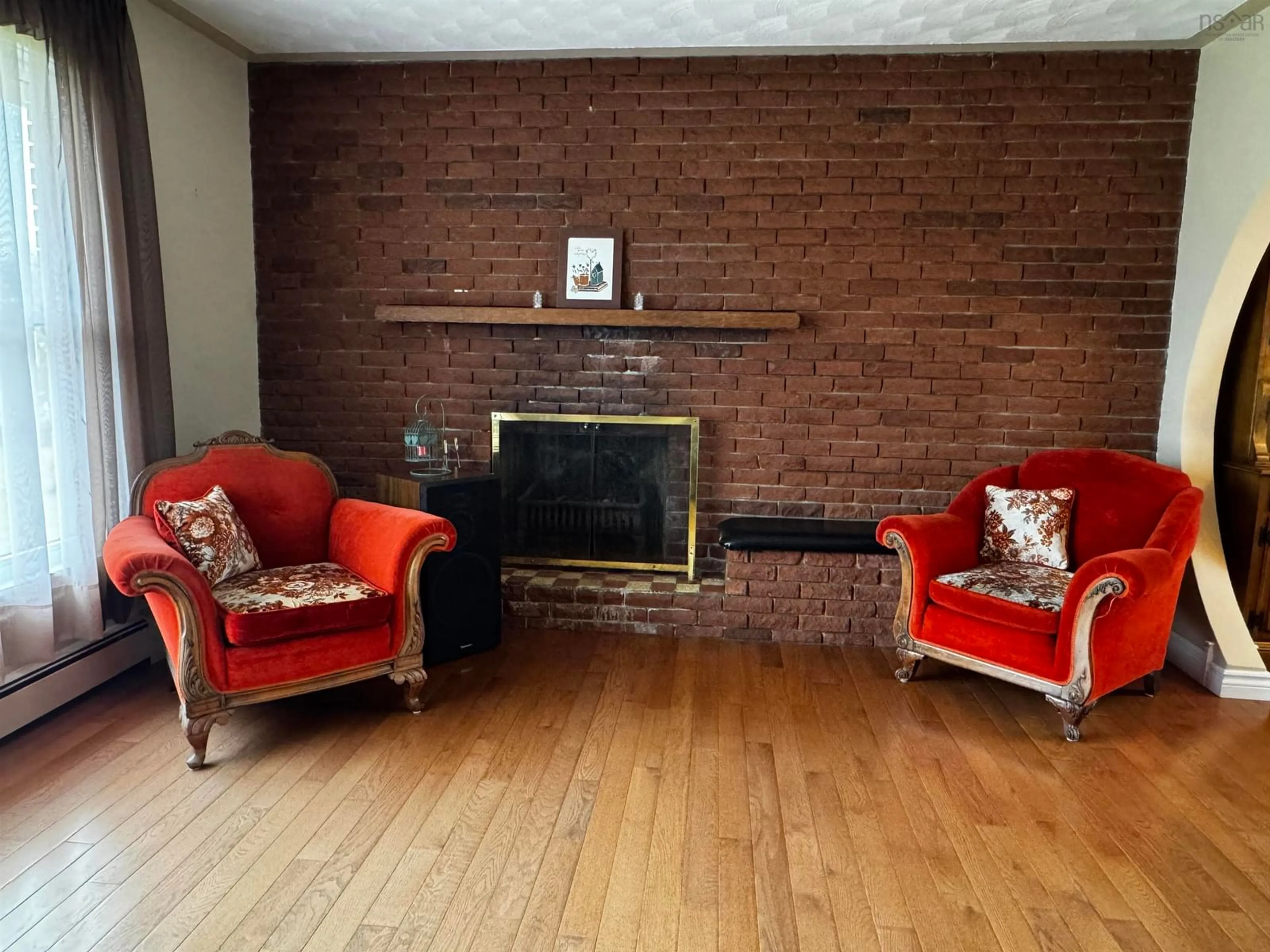Living room with furniture, wood/laminate floor for 4 Macaulay Ave, Glace Bay Nova Scotia B1A 1C9