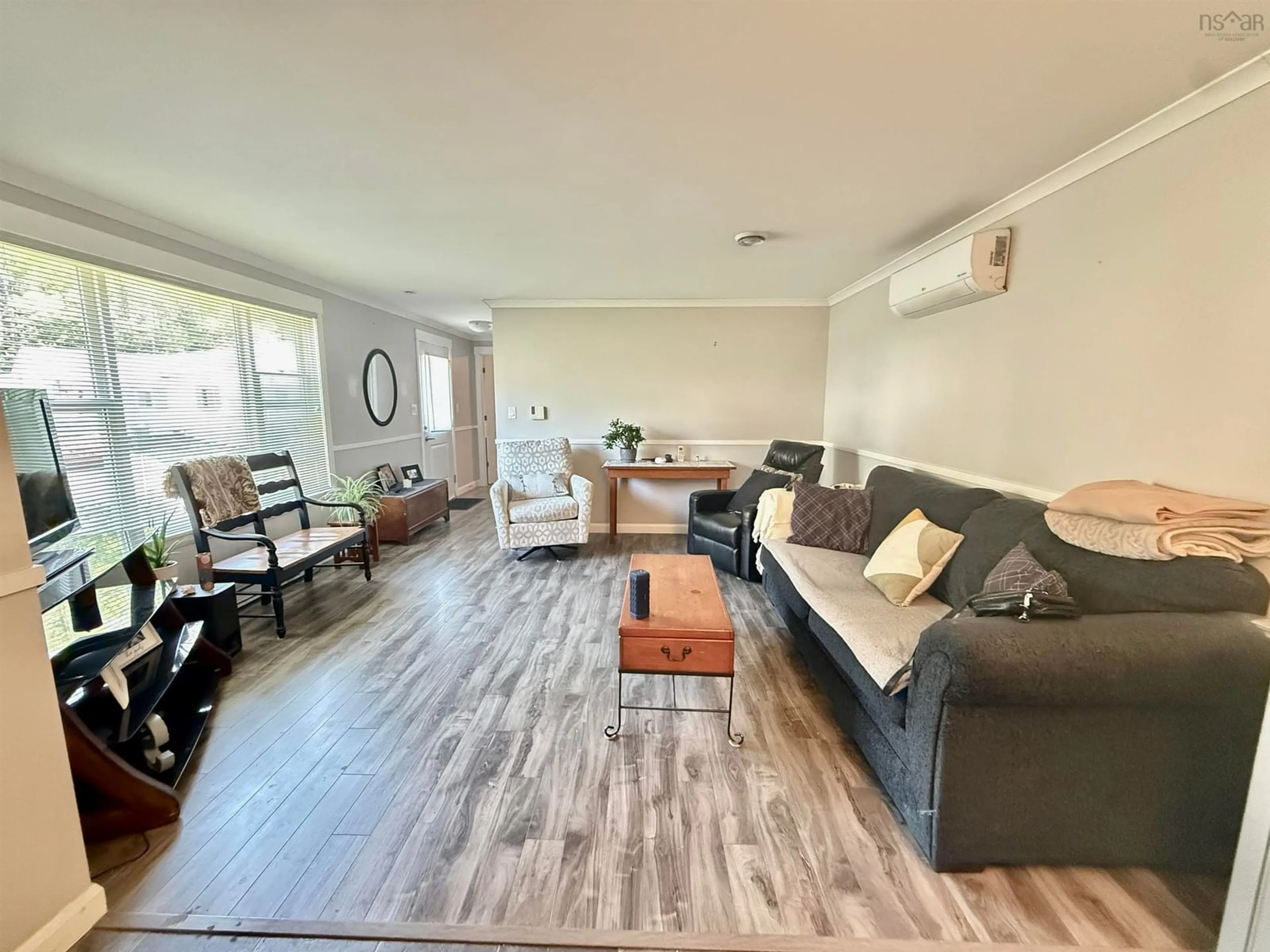 Living room with furniture, wood/laminate floor for 68 Brook St, Middle Sackville Nova Scotia B4E 1B9