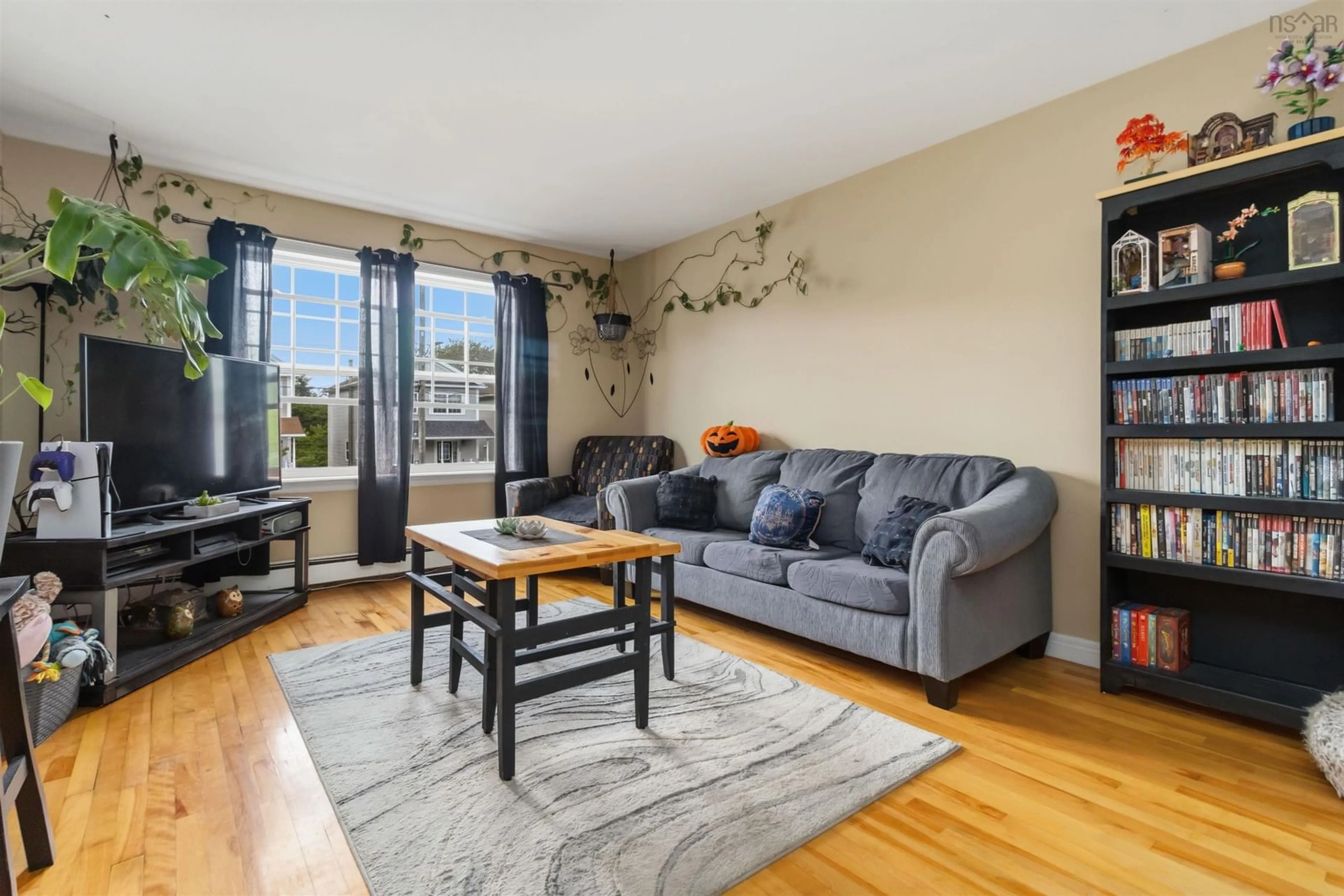 Living room with furniture, wood/laminate floor for 33 Sheppards Run, Beechville Nova Scotia B3T 2E6